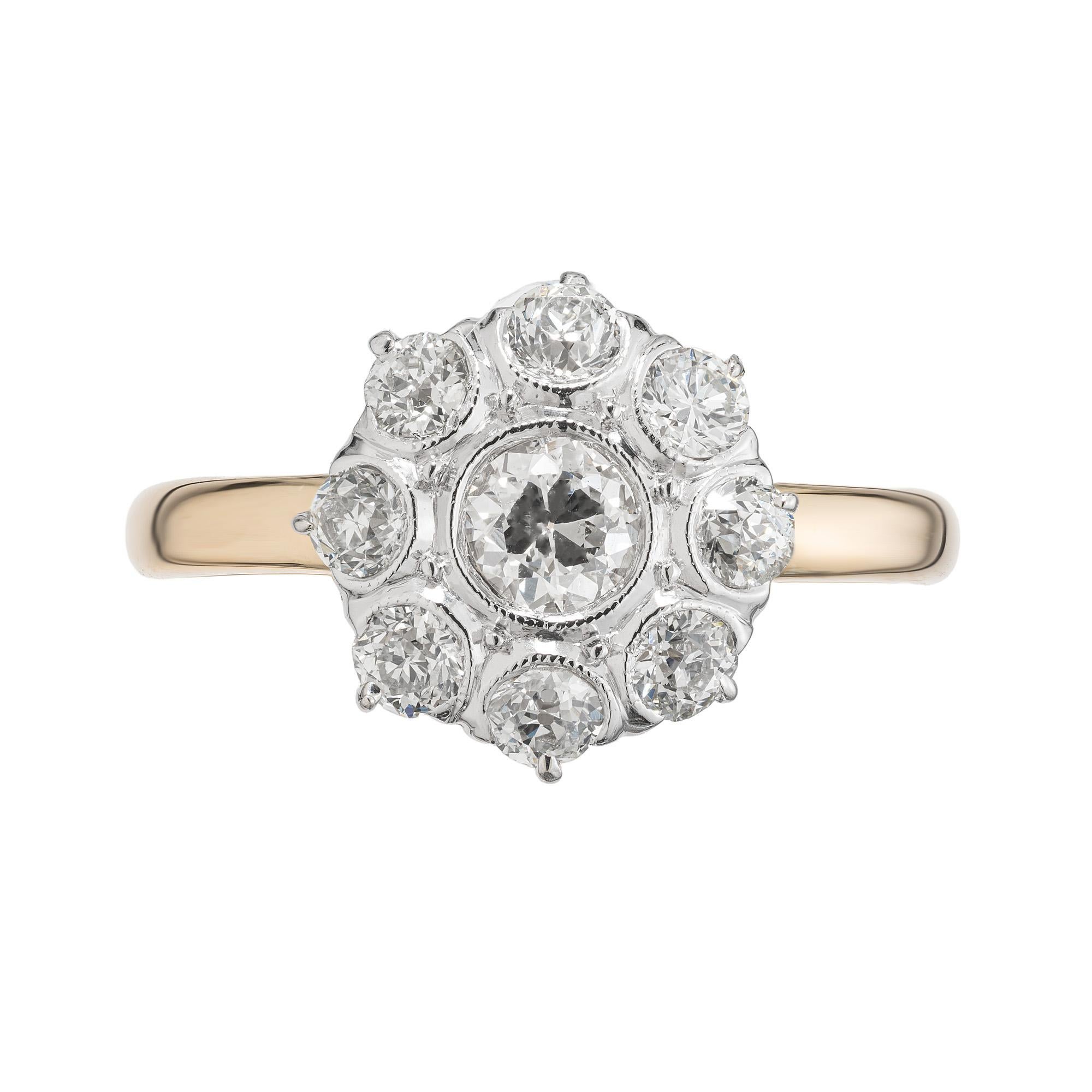 Original early 1900's old European cut diamond cluster ring in 14k gold and platinum. The center stone is a bezel set .35ct diamond mounted in platinum with a halo of 8 bright sparkly diamonds encricling it. The band is crafted from 14k yellow gold.