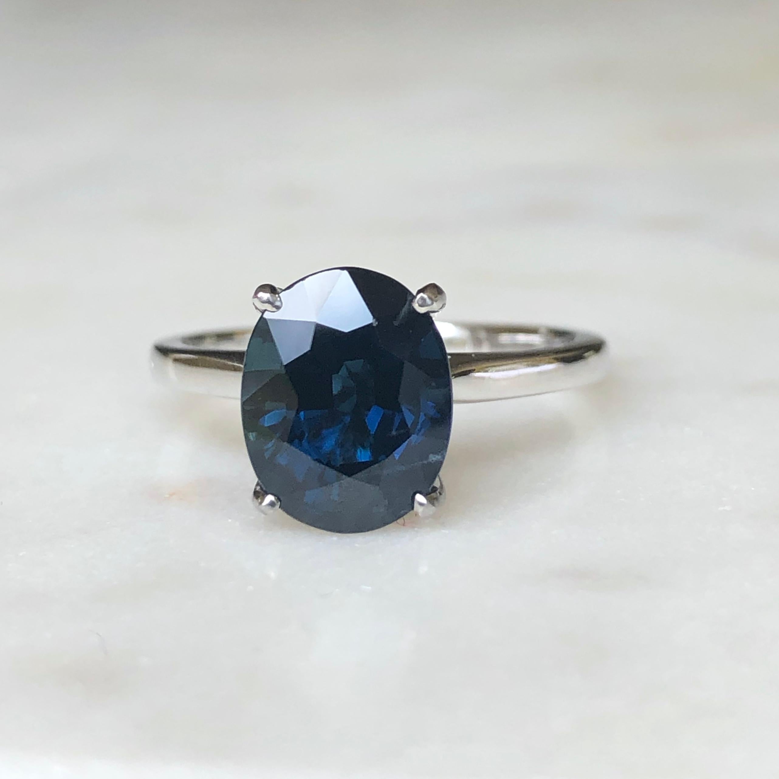 Stunning solitaire natural sapphire engagement ring. Set to centre with a natural oval cut deep blue sapphire with an approximate weight of 3.8 carats in an open back claw platinum setting.
This gorgeous engagement estate ring weight 5.1 Grams.