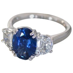 4.12 Carat Oval Sapphire Trapezoid Diamonds Platinum Ring at 1stdibs