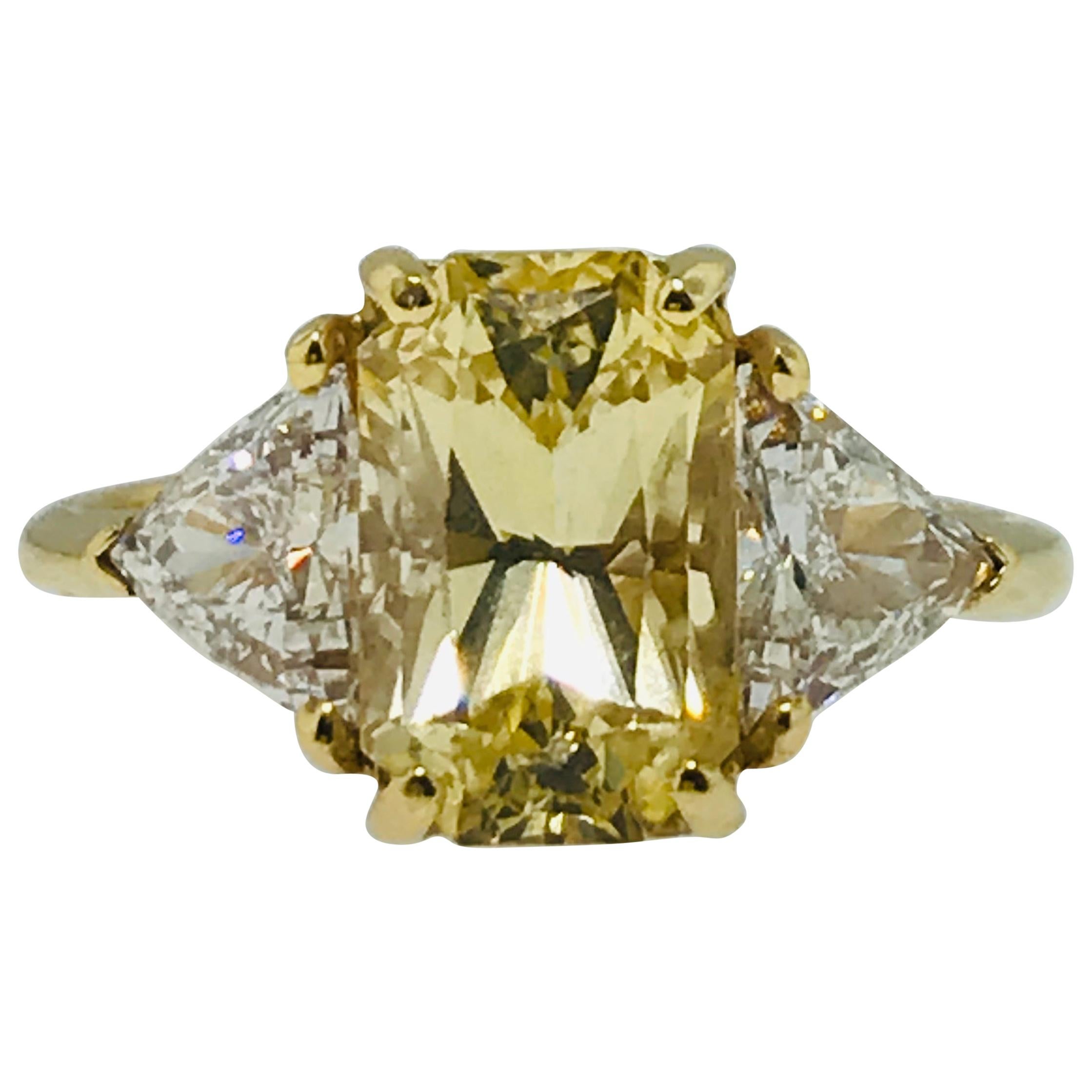 3.5 Carat Yellow Sapphire 
1.25 Carat Diamond Three-Stone Ring in 18 Karat Gold