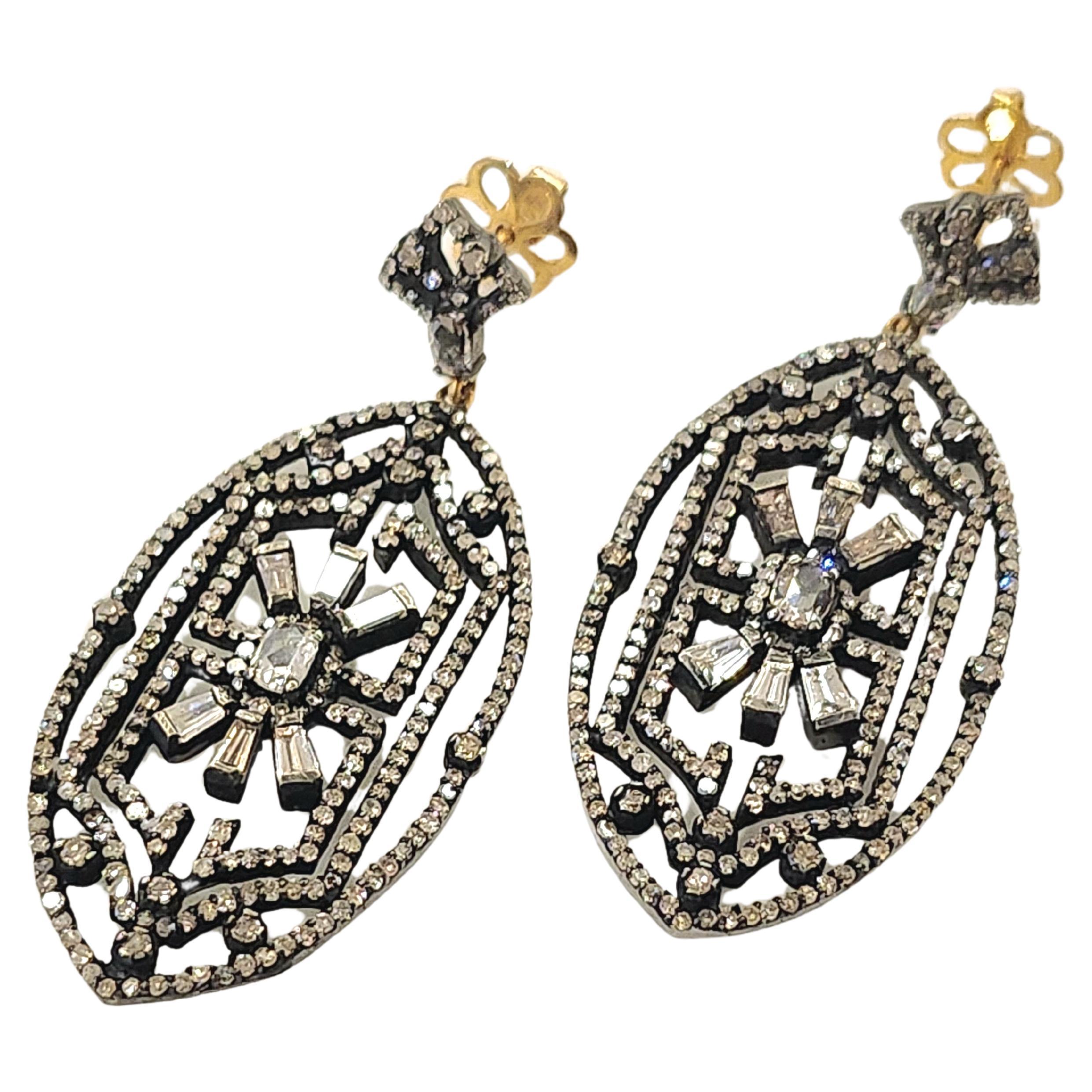 Large art deco open work style earrings with round and baguets brilliant cut diamonds with an estimate diamond weight 3.5 carars white color excellent spark in oxdized silver color with gold back lockets
