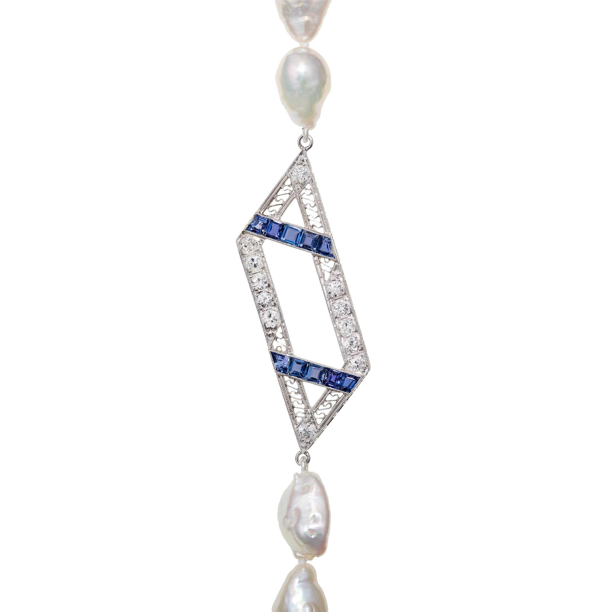 Gorgeous long necklace featuring a stunning Art Deco focal point.  One of a kind and hand knotted between each pearl.

Sapphire and Diamond Focal Point weighting approximately 3.5 Carats Total Weight
(53) South Sea Keshi Pearls

Length: 