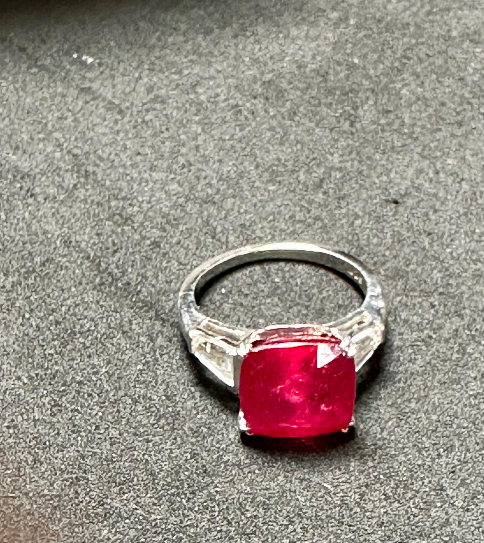 Cushion Cut 3.5 Ct Cushion Treated Ruby 14 Karat White Gold Ring With Two Baguette Diamonds For Sale