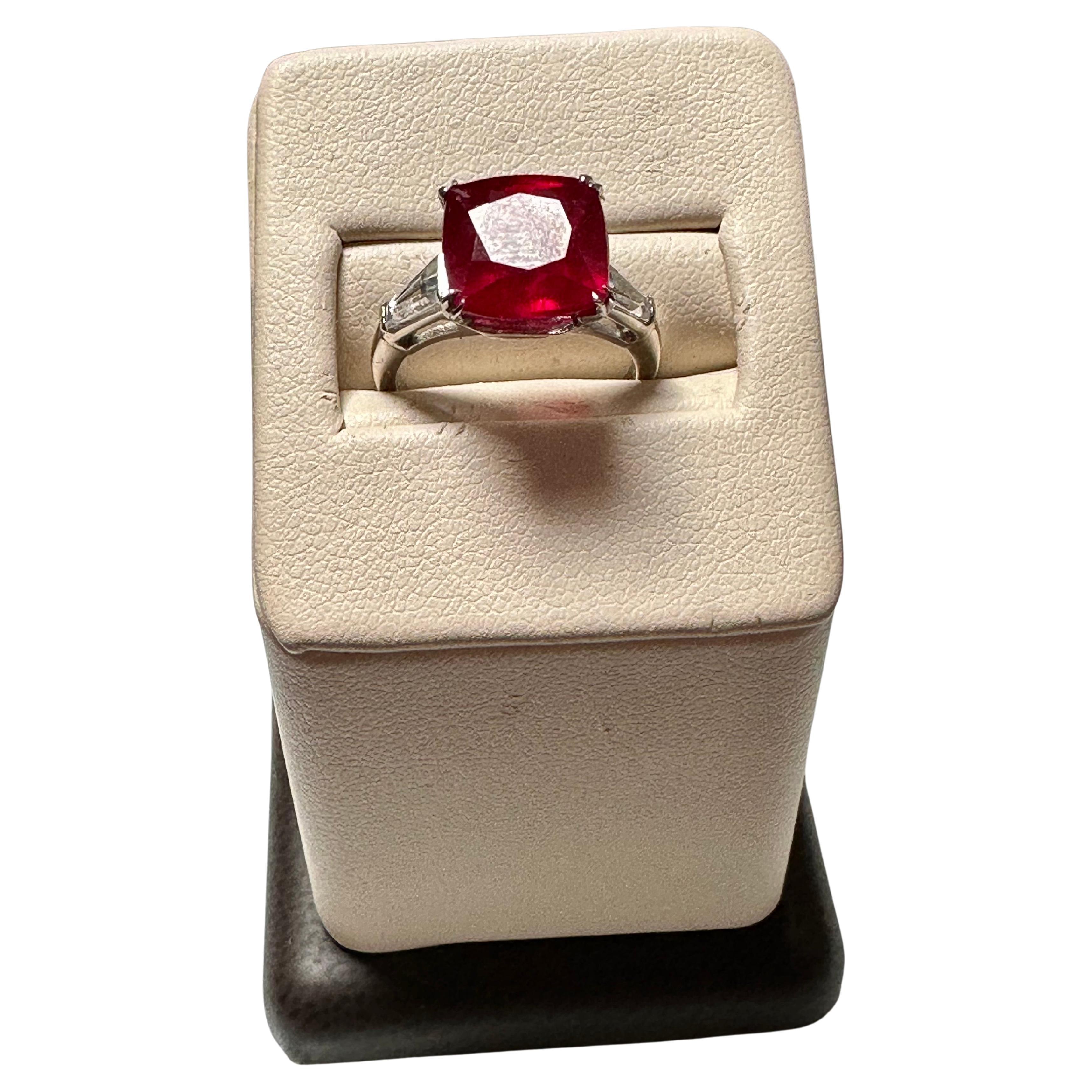3.5 Ct Cushion Treated Ruby 14 Karat White Gold Ring With Two Baguette Diamonds For Sale