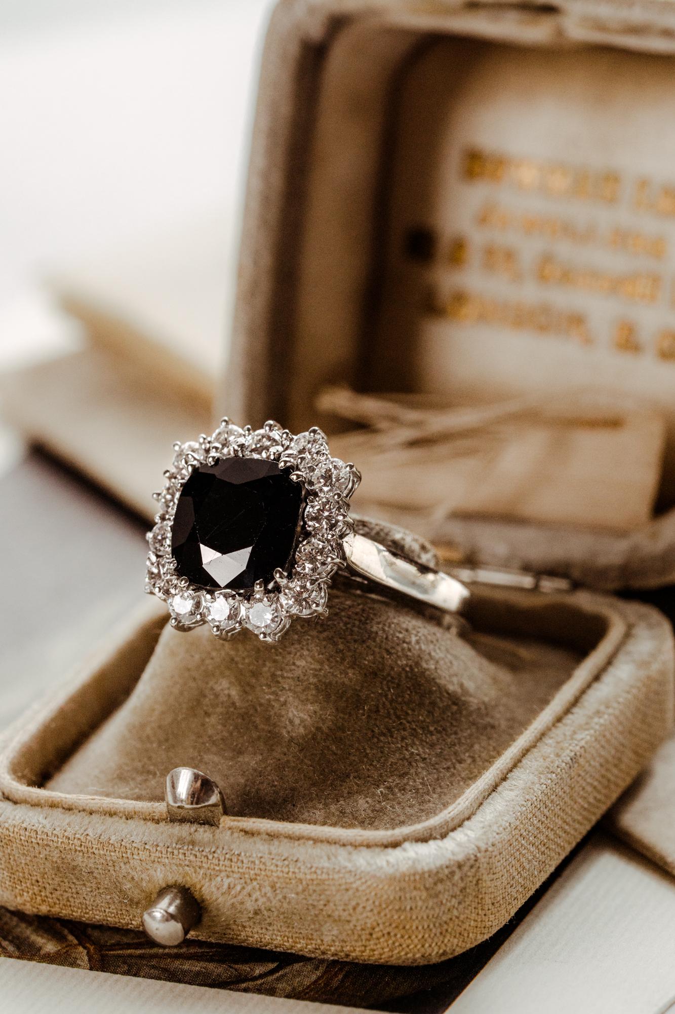 An incredible important 3.5 carat natural sapphire ring. This fine vintage engagement ring is crafted in 18k white gold and is fully certified.

Surrounded by a sparkling halo of 14 brilliant cut diamonds, the central cushion cut sapphire has a rich