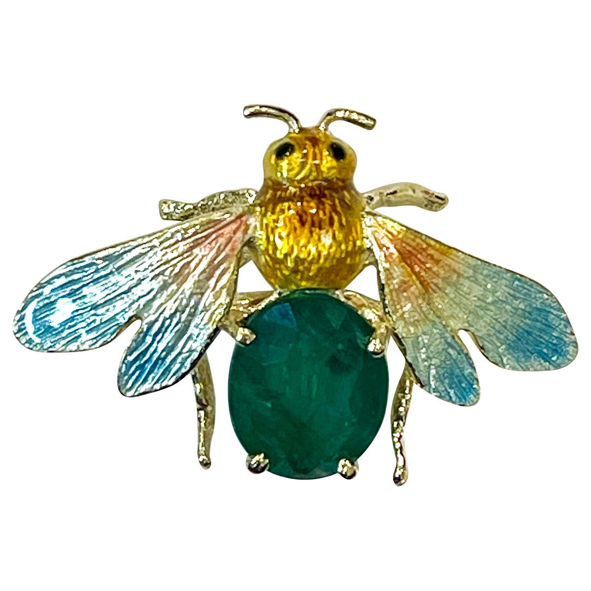 Antique Bug Shaped natural oval Emerald 14 Karat Gold Pin/Brooch with enamel 

Approximate weight of emerald is 3.5 carats to a gently curving Bug shape fitted to reverse with a secure brooch pin with safety catch .
14 Karat Gold 7.7 Grams
Emerald