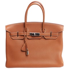35 Hermes Birkin, brown with dust cover and silver hardware stamped K
