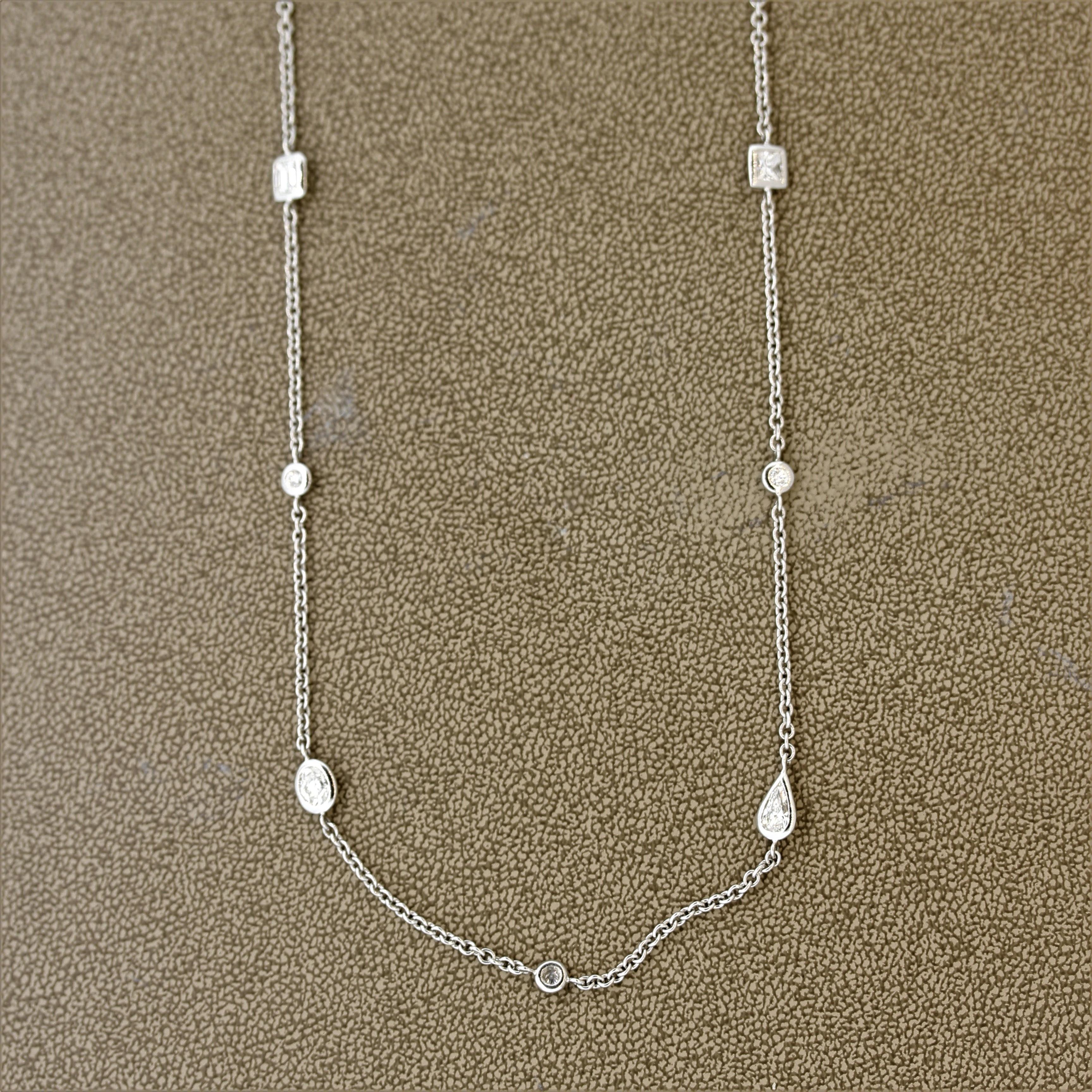 A unique styled “Diamonds by the Yard” necklace featuring large fancy cut diamonds! The 35-inch necklace features 21 individual diamonds, 11 of them being round brilliant cuts which are set between each larger fancy cut diamonds. The fancy shaped