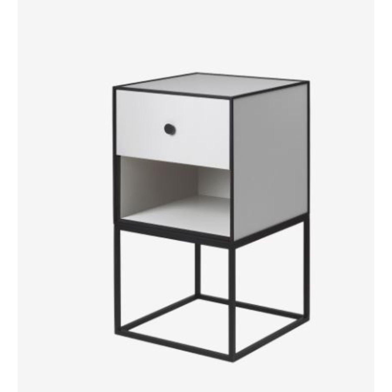 35 light grey frame sideboard with 1 drawer by Lassen.
Dimensions: W 35 x D 35 x H 63 cm. 
Materials: Finér, Melamin, Melamine, Metal, Veneer.
Also available in different colors and dimensions. 
Weight: 15.50 Kg

By Lassen is a Danish design