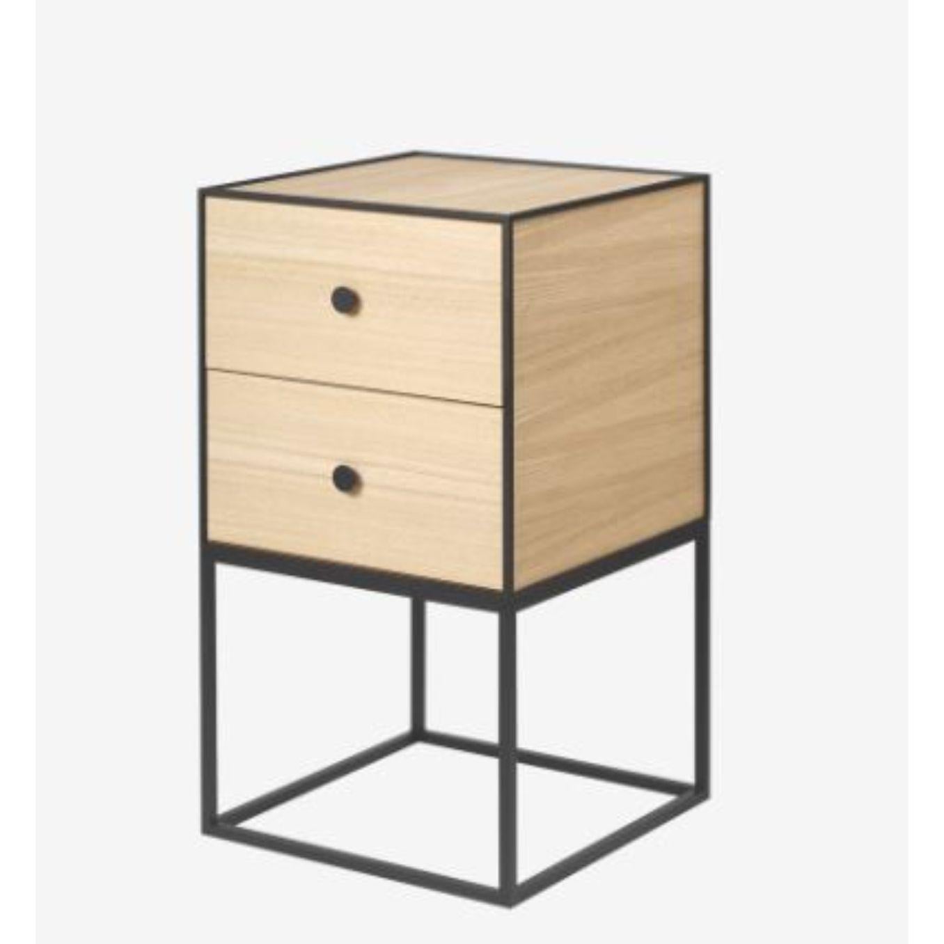 35 oak frame sideboard with 2 drawers by Lassen
Dimensions: D 35 x W 35 x H 63 cm 
Materials: Finér, melamin, melamine, metal, veneer, oak
Also available in different colours and dimensions.
Weight: 15.50 kg

By Lassen is a Danish design brand