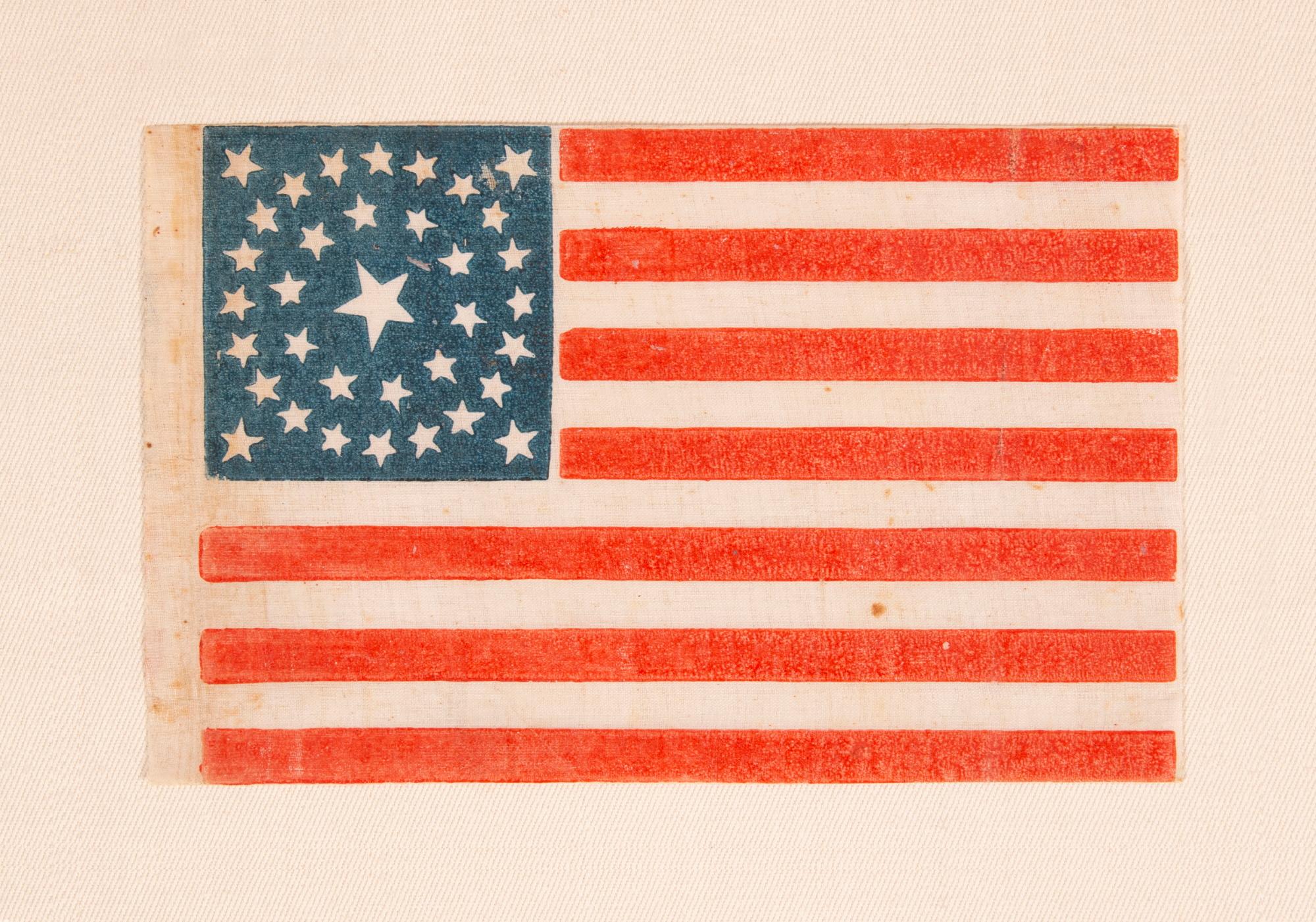 35 STAR ANTIQUE AMERICAN PARADE FLAG WITH A DOUBLE-WREATH STYLE MEDALLION CONFIGURATION OF STARS, PERHAPS THE BEST SURVIVING EXAMPLE IN THIS RARE FORM, CIVIL WAR PERIOD, WEST VIRGINIA STATEHOOD, 1863-1865

35 star American national flag,