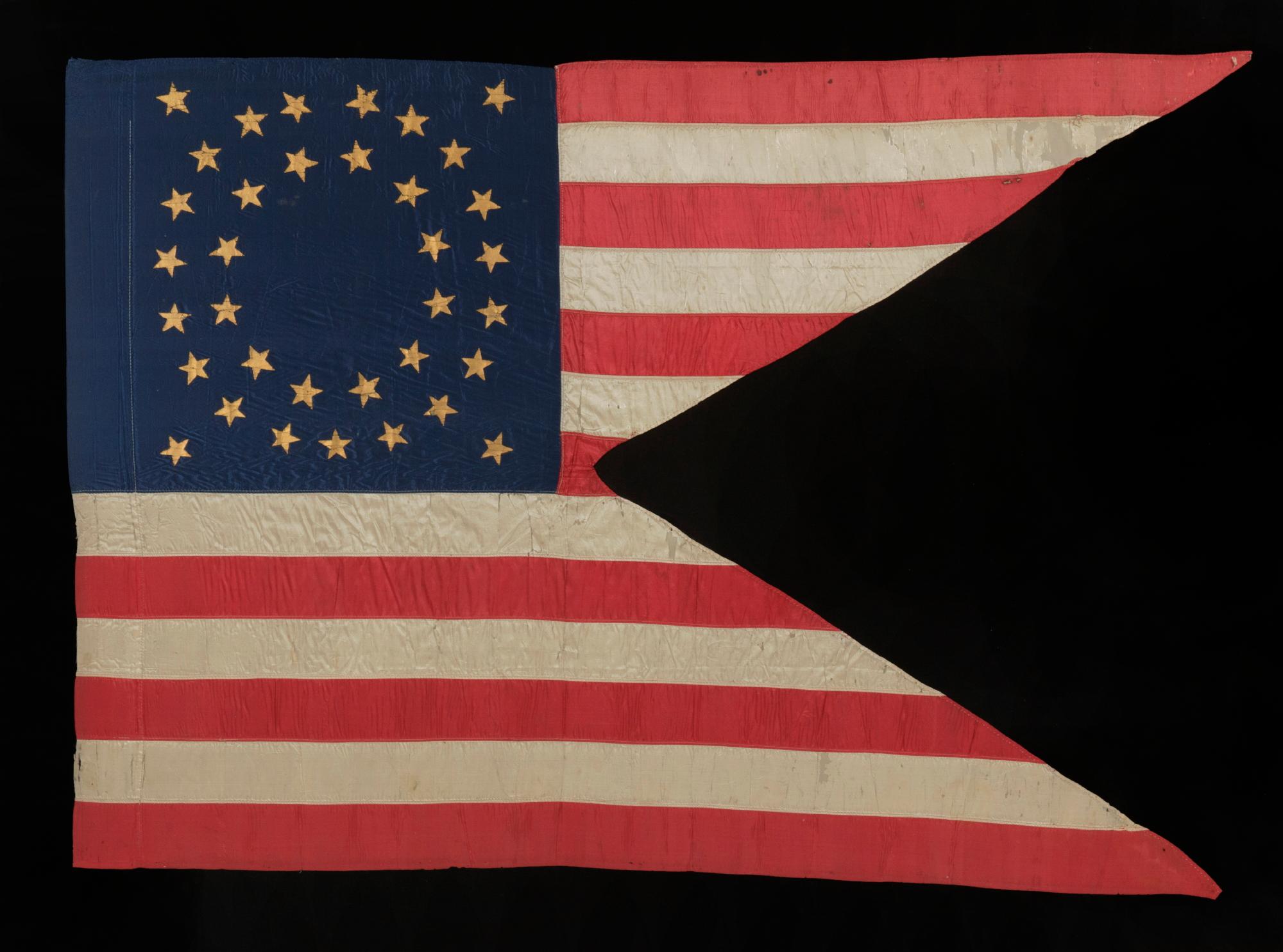 35 Star American Civil War Flag, a Silk Cavalry Guidon with gilt-painted stars in a double wreath arrangement, reflects West Virginia statehood, circa 1863-1865, in an exceptional state of preservation

Military issued, Union Army, Civil War