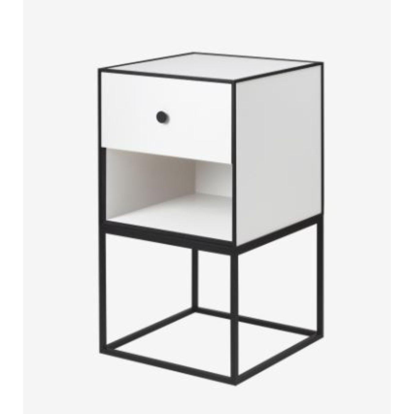 35 white frame sideboard with 1 drawer by Lassen
Dimensions: W 35 x D 35 x H 63 cm 
Materials: Finér, Melamin, Melamine, Metal, Veneer,
Also available in different colors and dimensions. 
Weight: 15.50 Kg

By Lassen is a Danish design brand