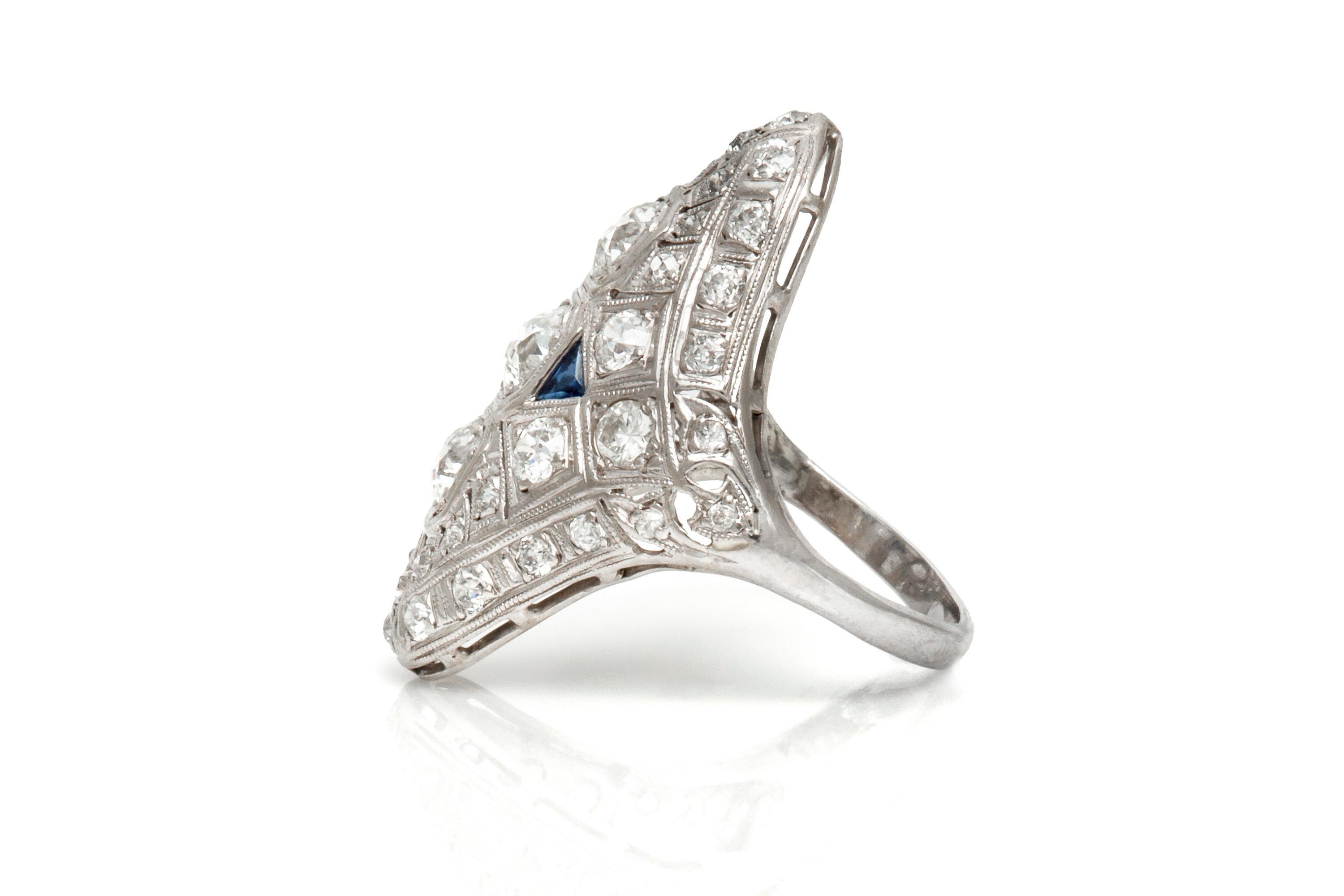 Finely crafted in platinum featuring old mine-cut diamonds weighing a total of approximately 3.50 carats and two accenting synthetic sapphires. 
Circa 1920's-1930's.