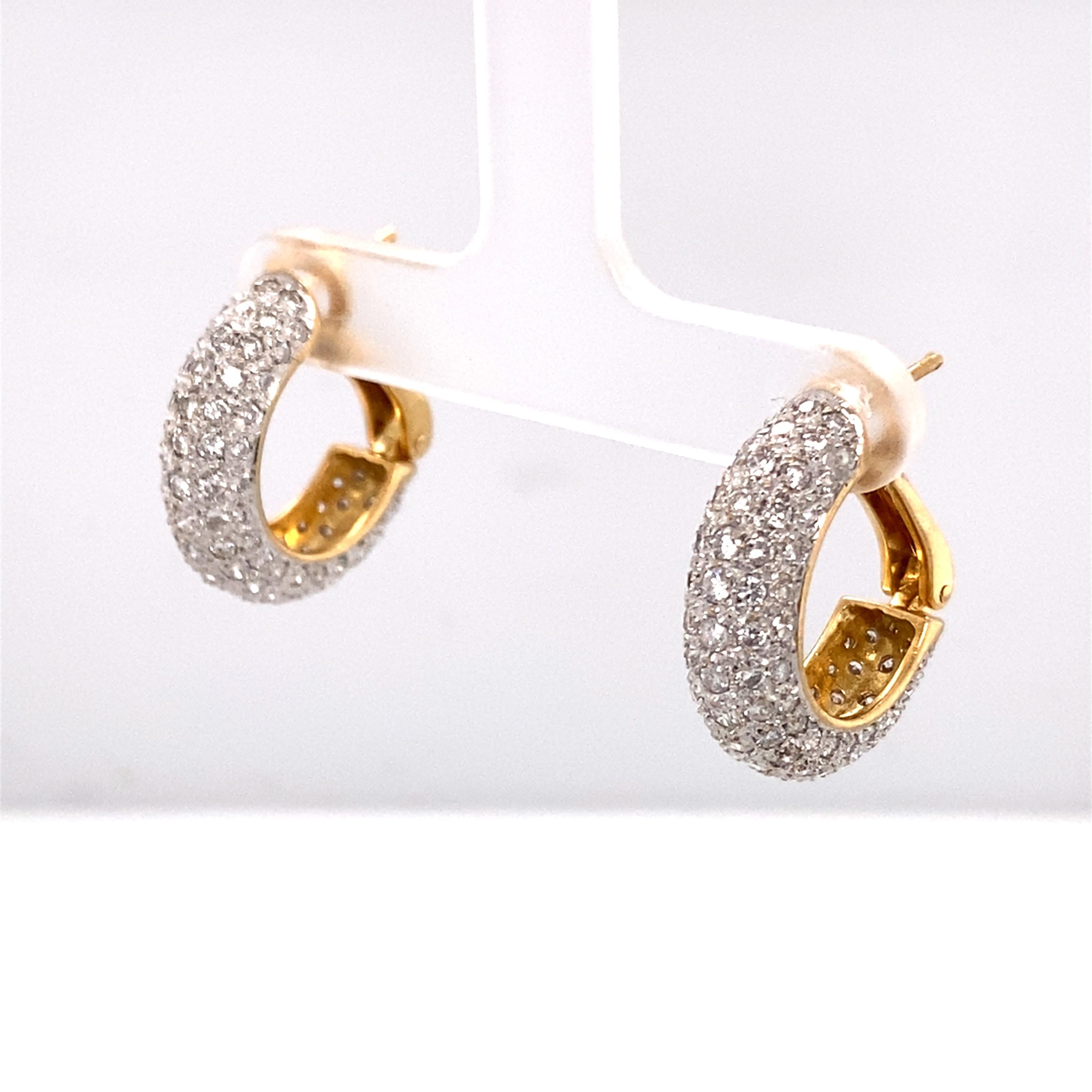 Item Details:
Type: 18 Karat Two Tone Gold
Weight: 9.6 grams
Measurements: .75 inches length x .50 inches width 

Diamond Details: 
Cut: Round 
Carat: 3.50
Cut: G-H
Clarity: VS

Item Features:
Beautiful 3.50 carat diamond hoop earrings in 18 karat