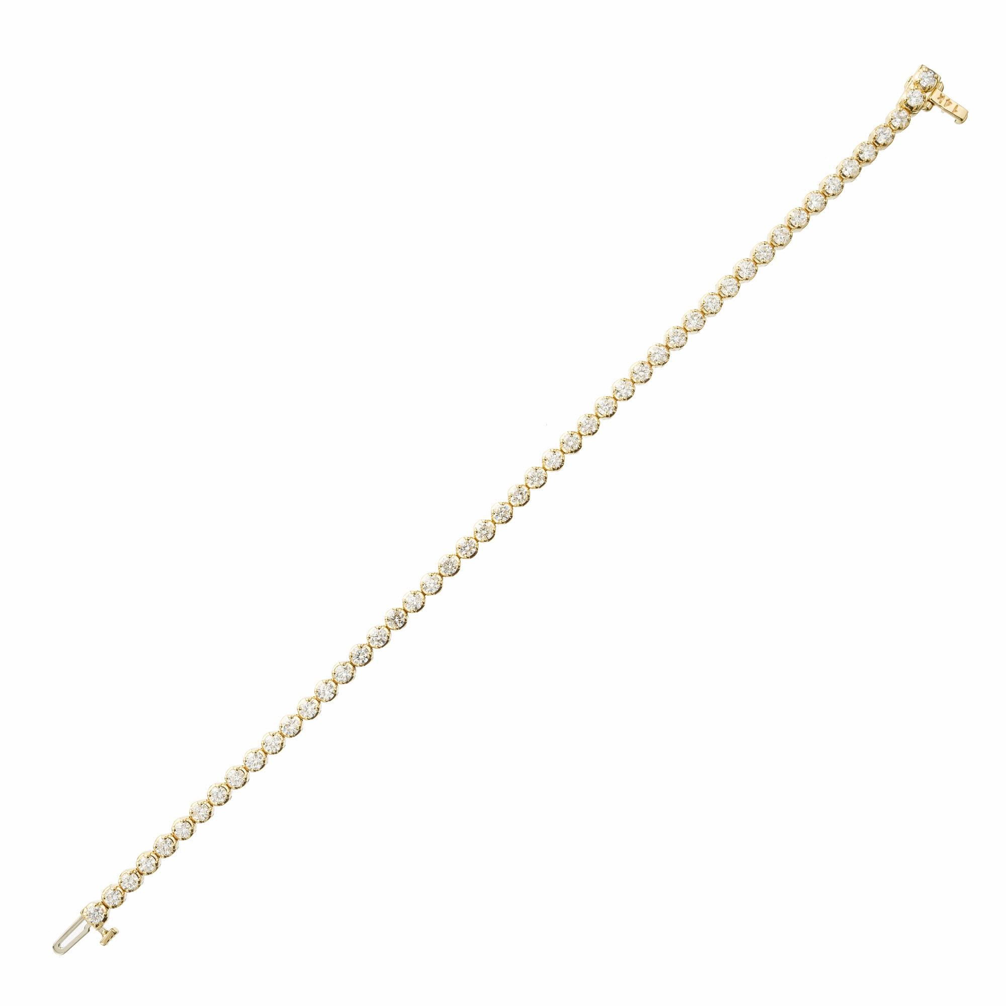 3.50 carat diamond tennis bracelet. 49 round diamonds in at 14k yellow gold tennis bracelet. Hidden catch and underside safety. 7 inches. 

49 round brilliant cut diamonds, H-I SI approx. 3.50cts
14k yellow gold 
Stamped: 14k 3.50ct
8.7 grams
Total