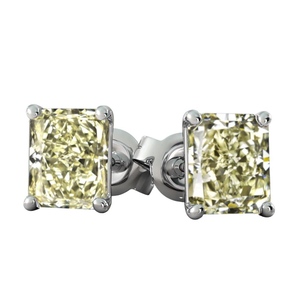 An exquisite pair of fancy light yellow radiant cut diamond studs they weight 3.50 carats together and they are vs1 in clarity!

This magnificent pair of diamonds are mounted in Italy with 18 carats white diamond.

If you will like us to mount in a