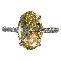 3.50 Carat Fancy Yellow Oval Diamond Ring, VVS1, GIA Certified