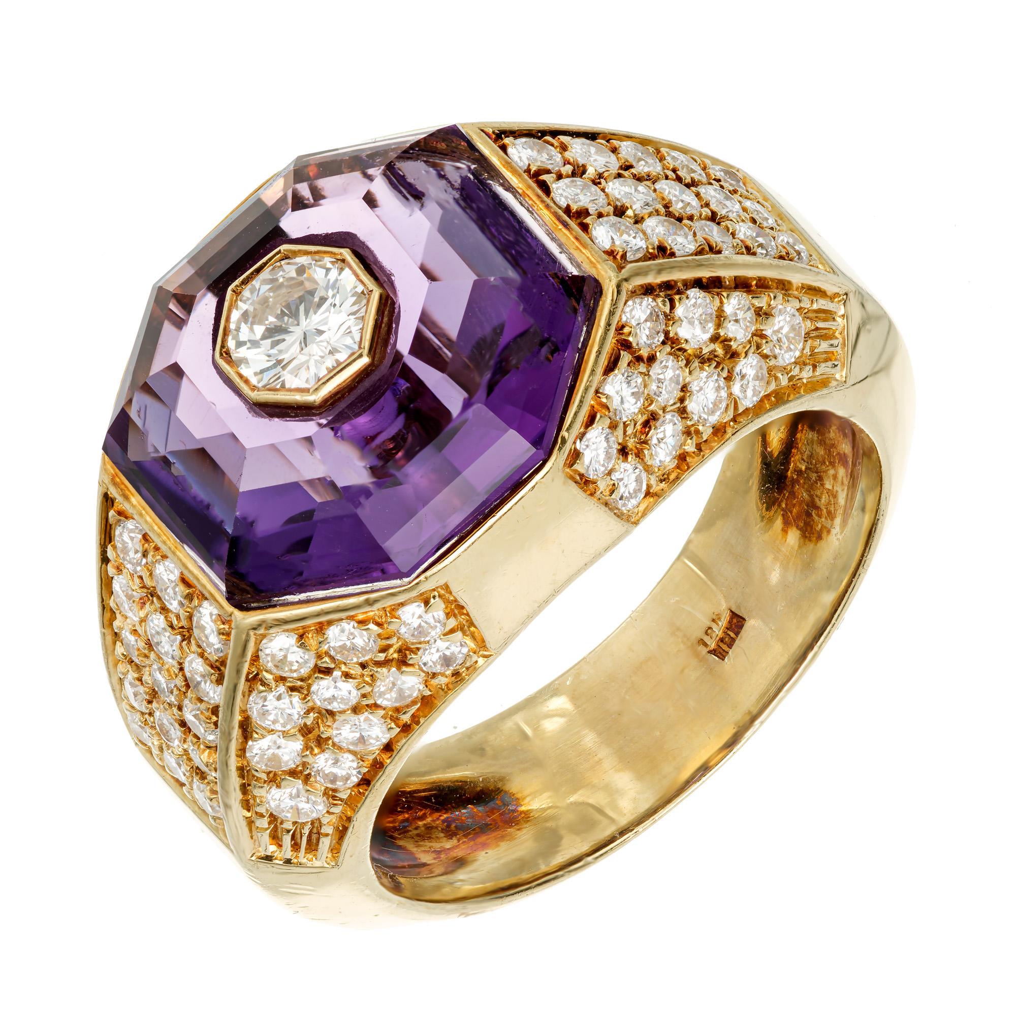 1960's mid-century diamond and amethyst yellow gold ring. .16ct center diamond with a eight sided faceted step cut amethyst halo set in an 18k yellow gold setting with 74 full cut round diamonds.

12 x 12mm genuine 8 sided Amethyst 3.50ct
1