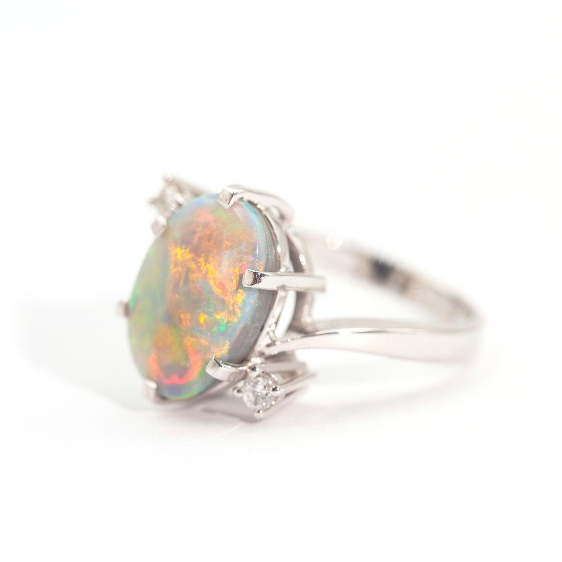 3.50 Carat Oval Solid Opal and Round Brilliant Vintage 18 Carat White Gold Ring For Sale 4