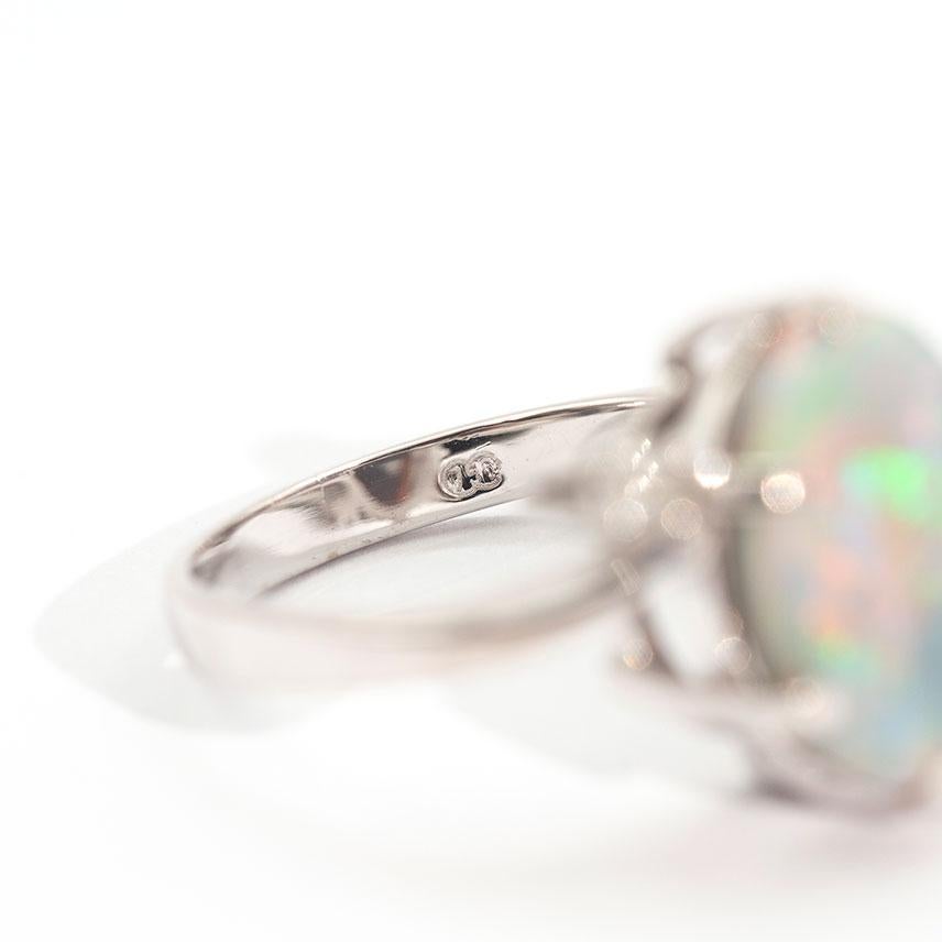 3.50 Carat Oval Solid Opal and Round Brilliant Vintage 18 Carat White Gold Ring For Sale 6