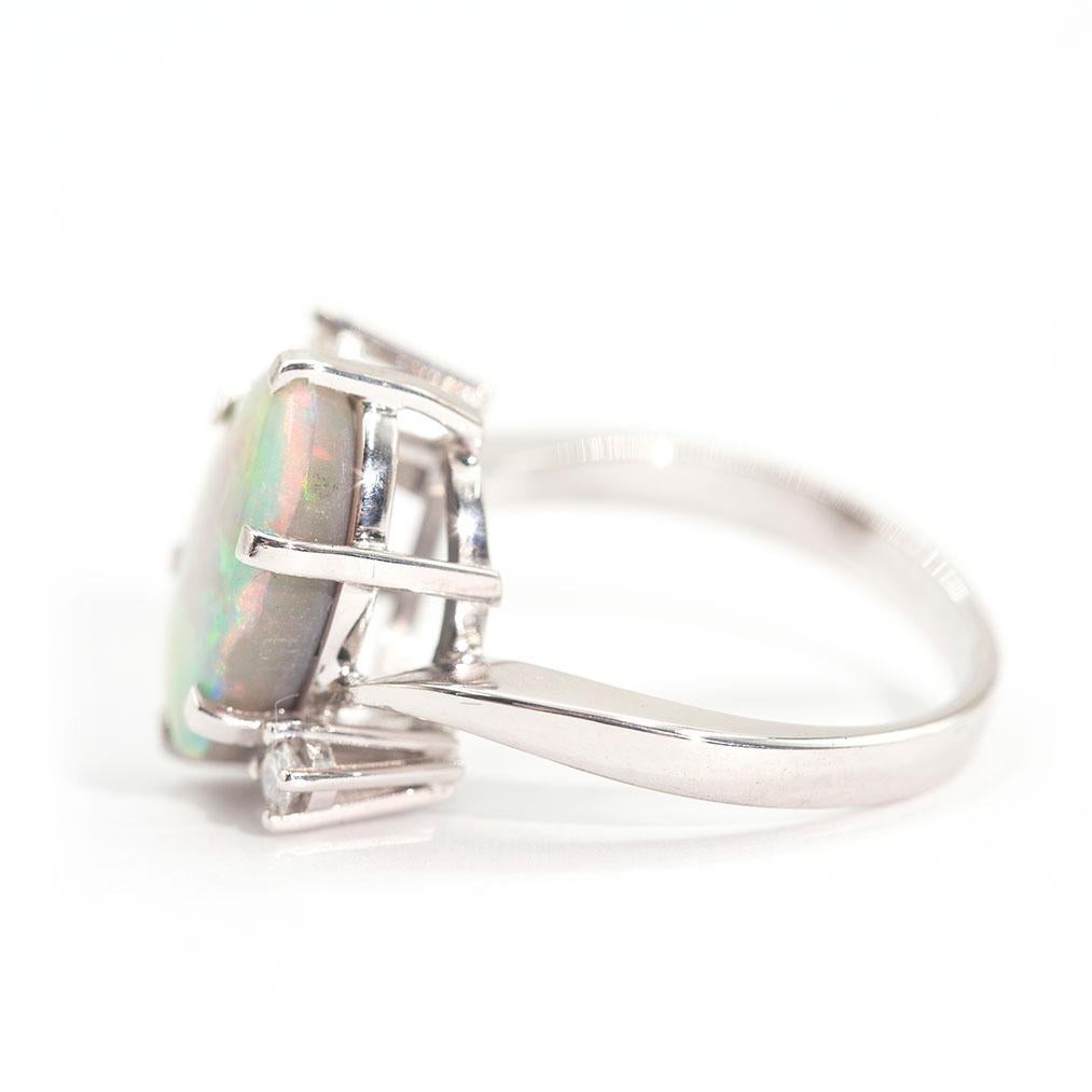 3.50 Carat Oval Solid Opal and Round Brilliant Vintage 18 Carat White Gold Ring For Sale 3