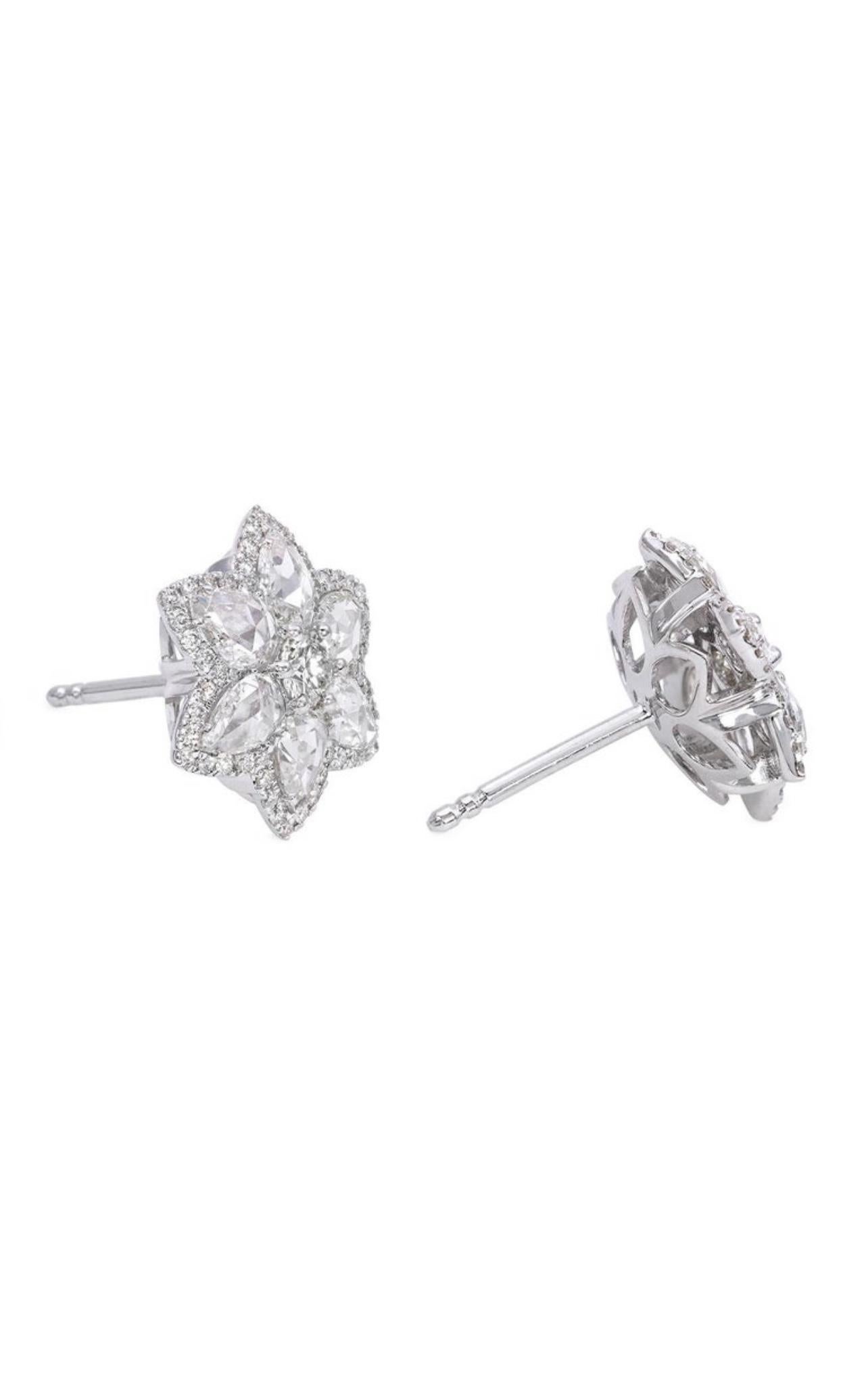 Refreshingly Unique Rose Cut And Round brilliant cut diamond star stud earrings handcrafted in 18k white gold . 
The details are as follows : 
Diamond weight : round brilliant center : 0.84/2 carats ( HI color and VS clarity ) 
Rose cut diamond