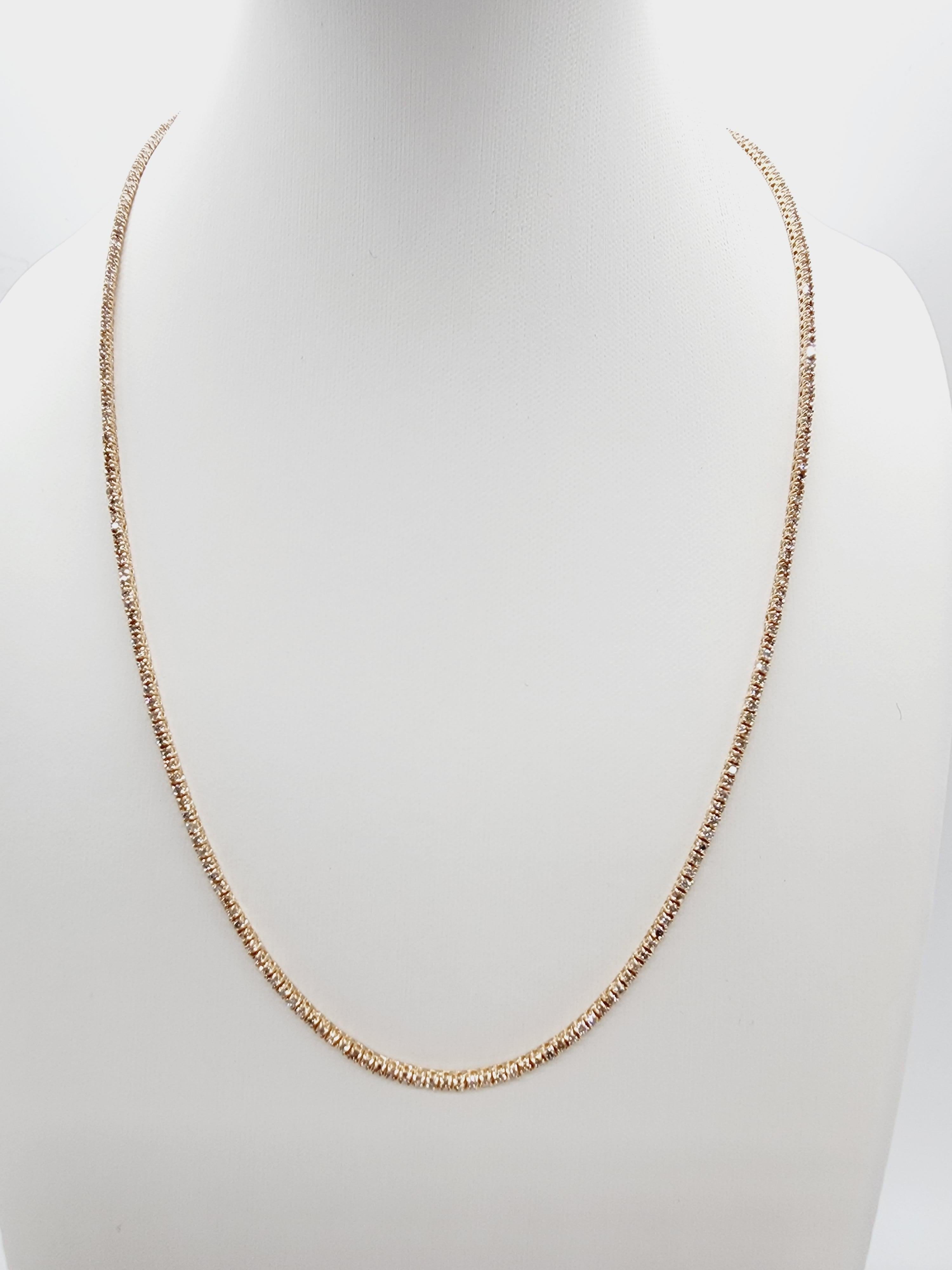 Brilliant and beautiful tennis necklace, natural round-brilliant cut white diamonds clean and Excellent shine. 14k rose gold classic four-prong style for maximum light brilliance. Elegance for every occasion.

18 inch length. 
Average H Color, SI
