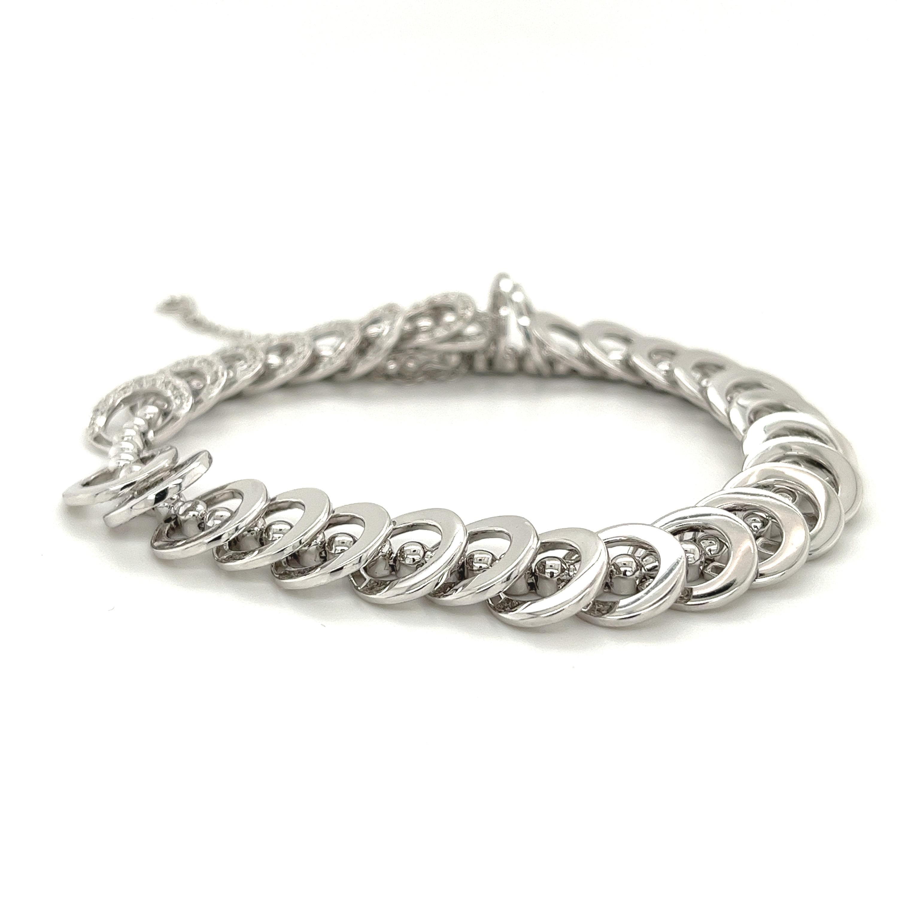 Introducing this one-of-one, 18 karat solid white gold natural diamond link bracelet. Hypoallergenic, shower safe, and engineered for daily wear. 7 inches with a 2.5-inch extension piece. 

This bracelet is a showstopping head-turner that you will