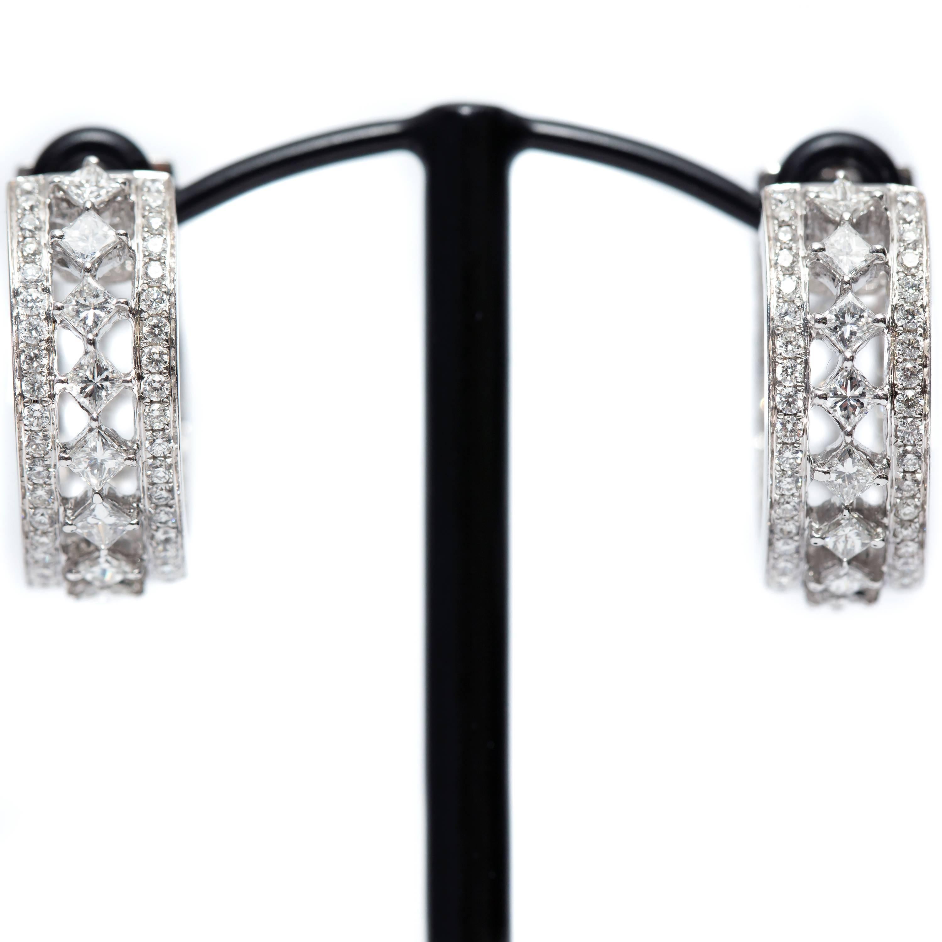 An impressive and cleverly set 3.50 Carat Diamond, 1.92 Carat Round and 1.58 Carat Princess cut hoop earrings set in 18 Karat White Gold, with color H and clarity SI1. The princess cut Diamonds are set diagonally in a channel design between two rows