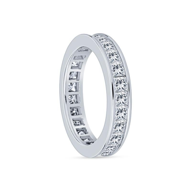 This exquisite women's wedding band features a brilliant display of princess cut diamonds channel set in luxurious 14 karat white gold. With a total weight of 3.50 carats, this timeless piece combines elegance and durability, perfect for symbolizing