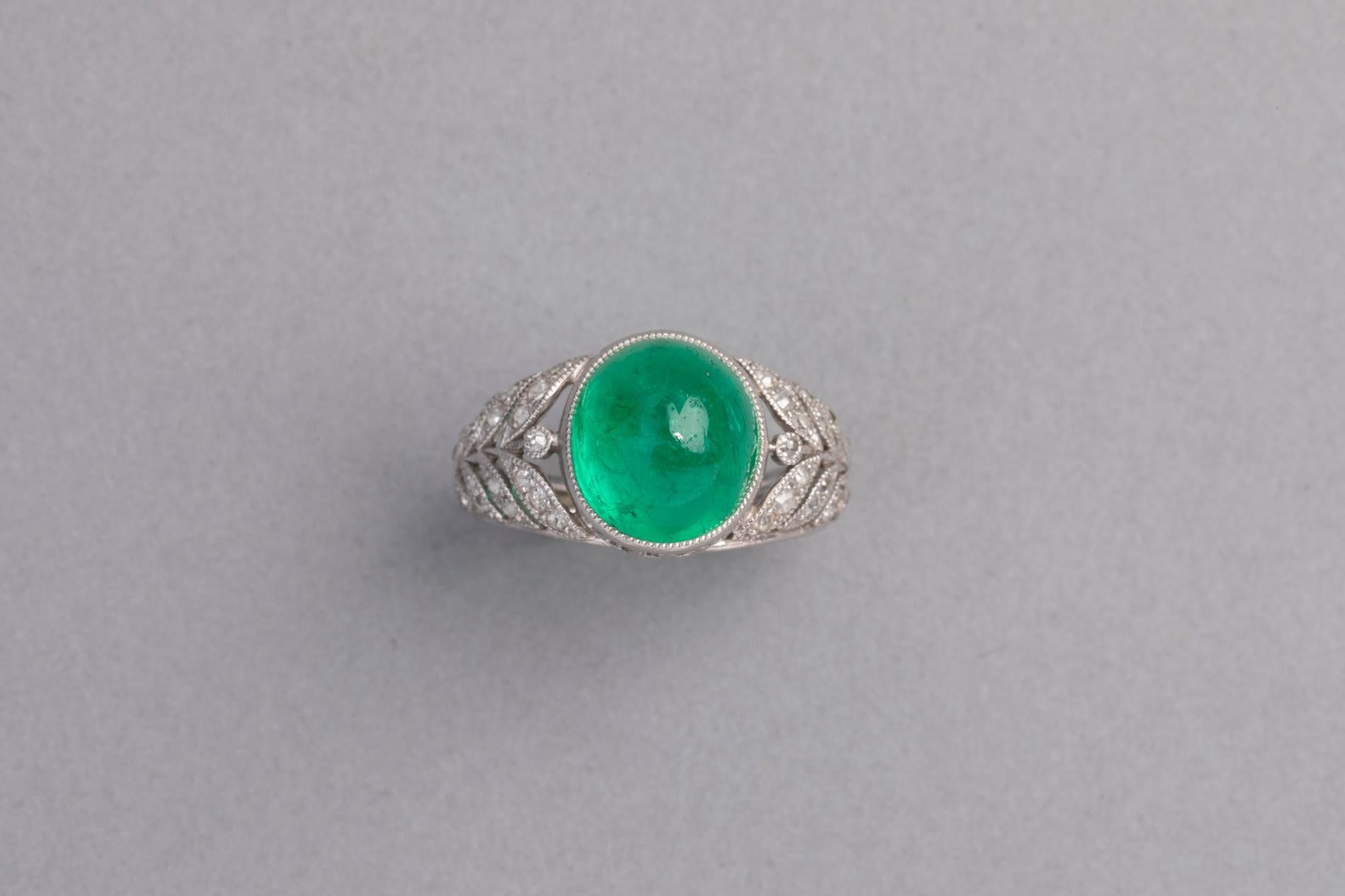 3.50 Carats Antique Colombian Emerald Ring, Platinum and Diamonds

This is a very beautiful Ring, made in France circa 1920, early Art Deco. 
 The ring is mounted with Platinum( French Hallmarks, the old man), and set with a Certified Colombian