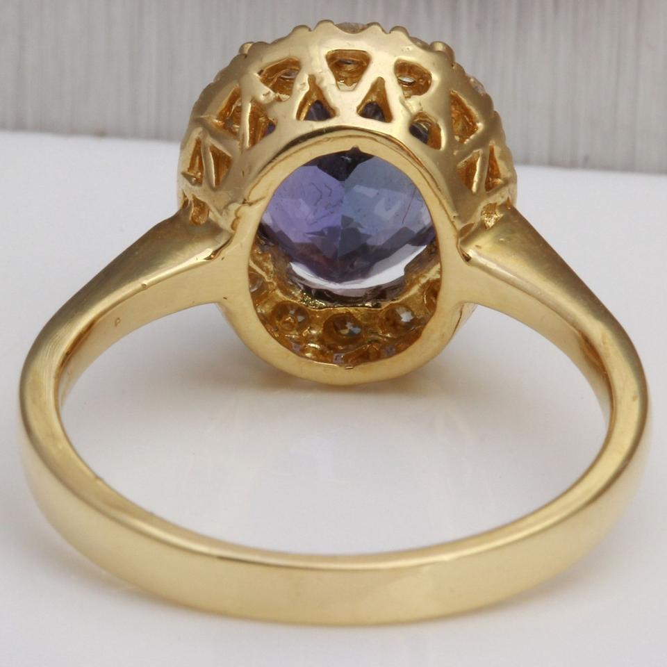 Women's 3.50 Carat Natural Tanzanite and Diamond 14 Karat Solid Yellow Gold Ring For Sale