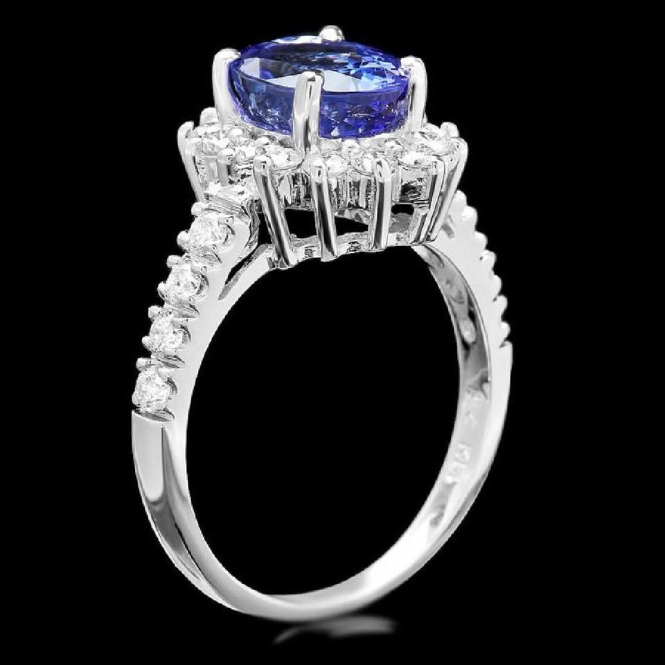 3.bague en or blanc massif 14K avec tanzanite et diamant d'un très bel aspect naturel de 50 carats

Le poids total de la tanzanite naturelle taillée en coussin est de : Environ 2,80 carats

Mesures de la tanzanite : Environ 9.00 x 7.00mm

Diamants