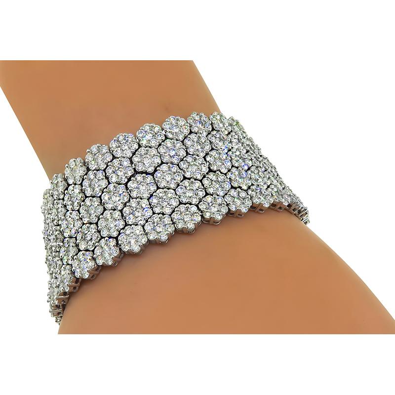 This is a gorgeous 18k white gold bracelet. The bracelet is set with sparkling round cut diamonds that weigh approximately 35.00ct. The color of these diamonds is F-G with VS clarity. The bracelet measures 7 inches in length and 25.5mm in width. The