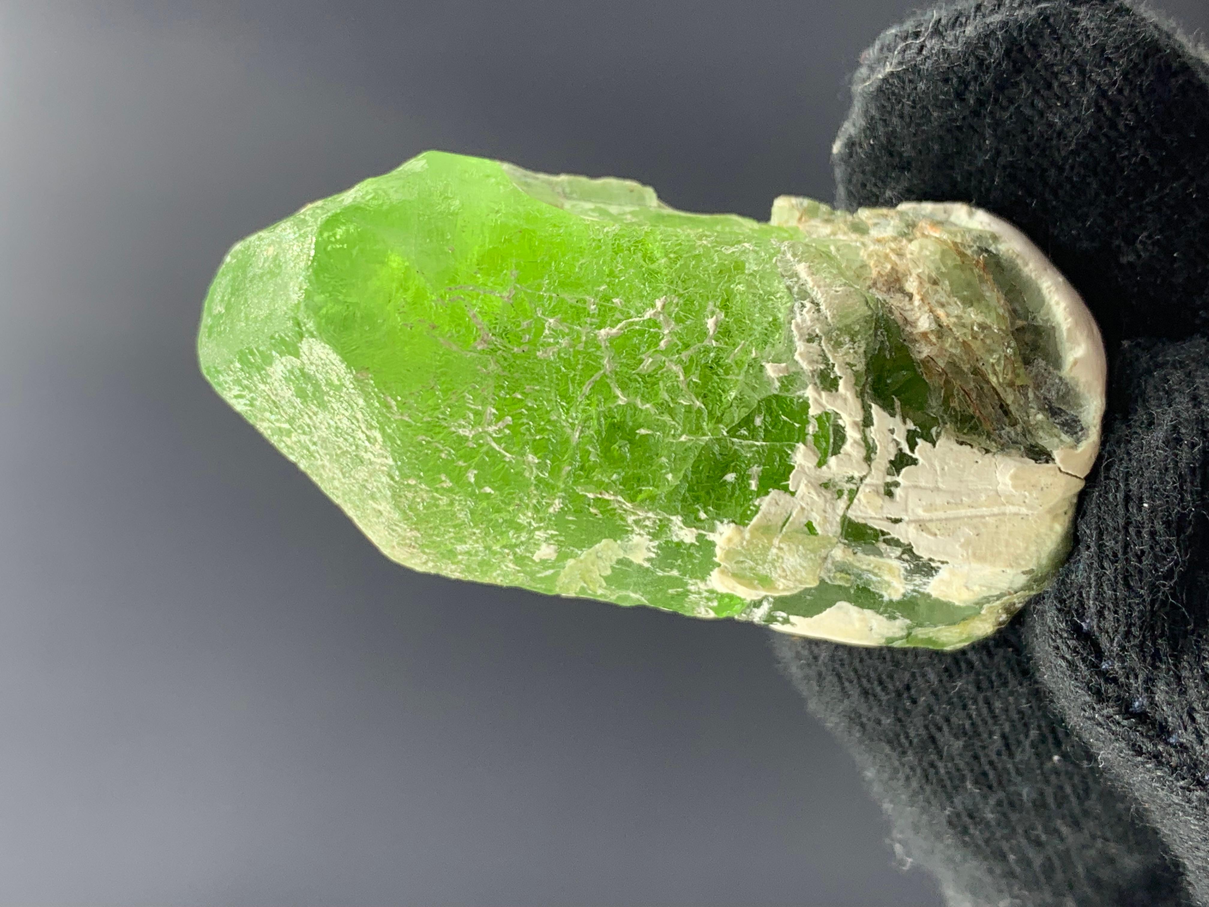 35.03 Gram Apple Green Peridot Specimen From Supat Valley, Pakistan 

Weight: 35.03 Gram 
Dimension: 4.4 x 2.1 x 2 Cm 
Origin: Supat Valley, Mansehra District, Pakistan 

Peridot is a popular stone for protection against difficulties and negativity.