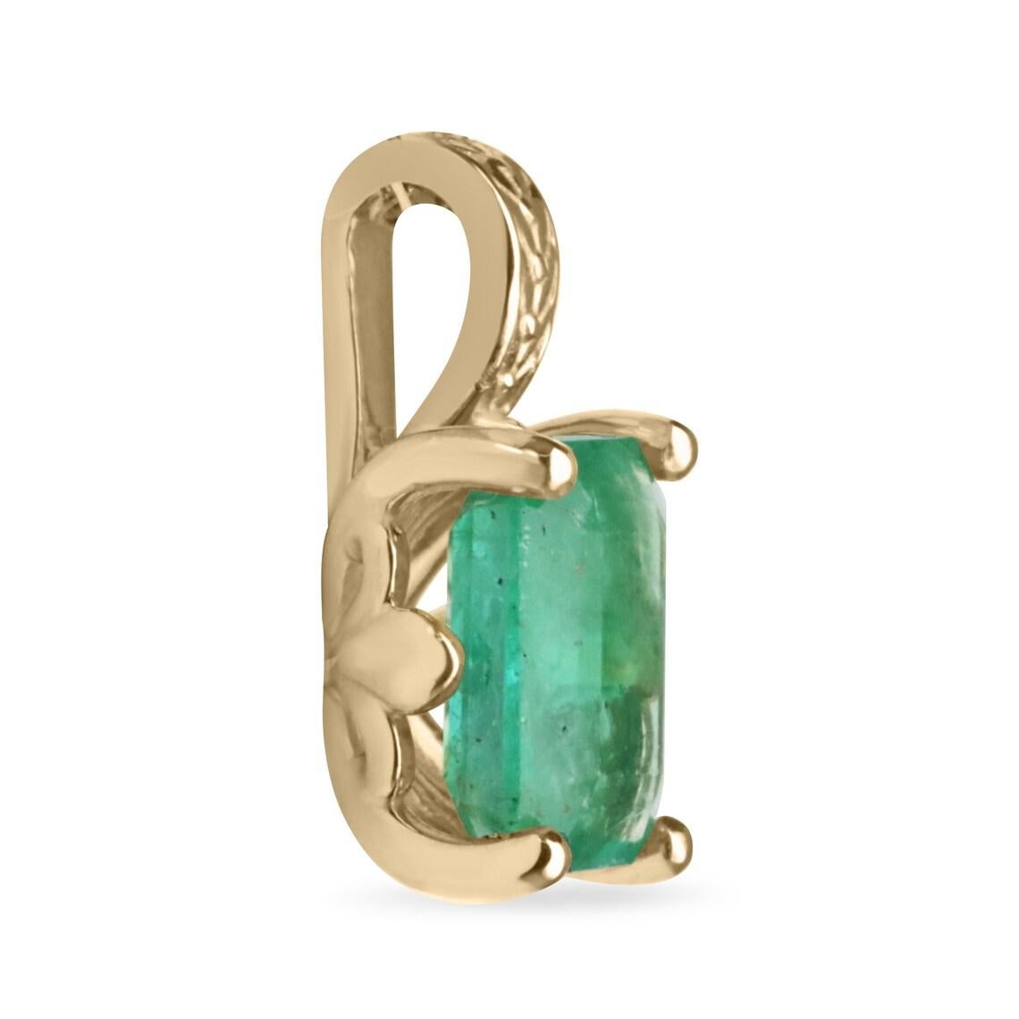 This exquisite emerald solitaire pendant features a 3.50-carat emerald-cut natural emerald, displaying a rich, verdant hue with semi-transparent clarity that catches the light beautifully. The gemstone is secured in a four-prong setting, accented by