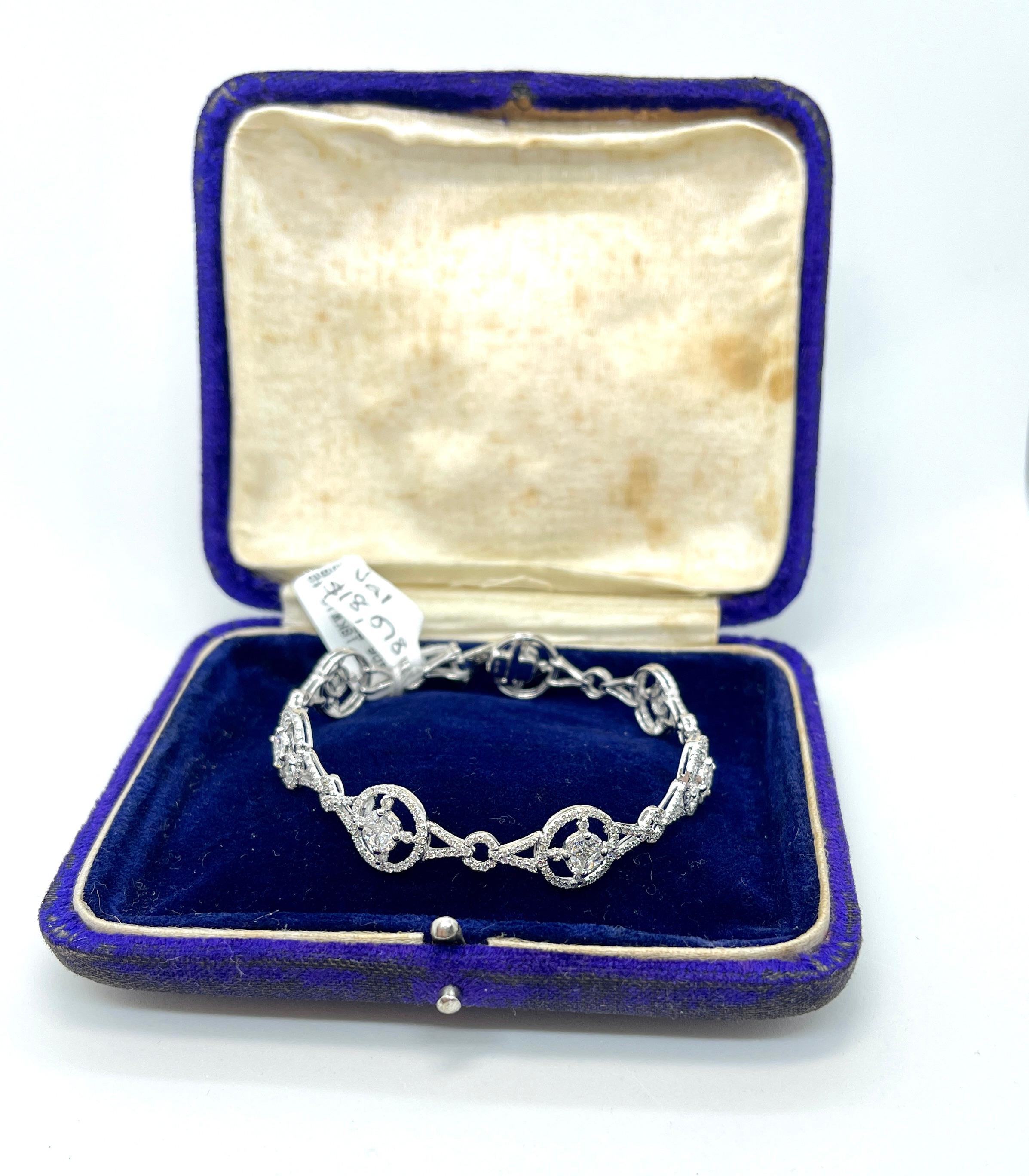 Very Sparkly Diamonds on offer here!

This stylish bracelet features a combination of vari-cut sparkly white Diamonds set in 18ct white gold. It’s a pretty piece that consists of circular flower clusters joined by flexible links and is comfortable