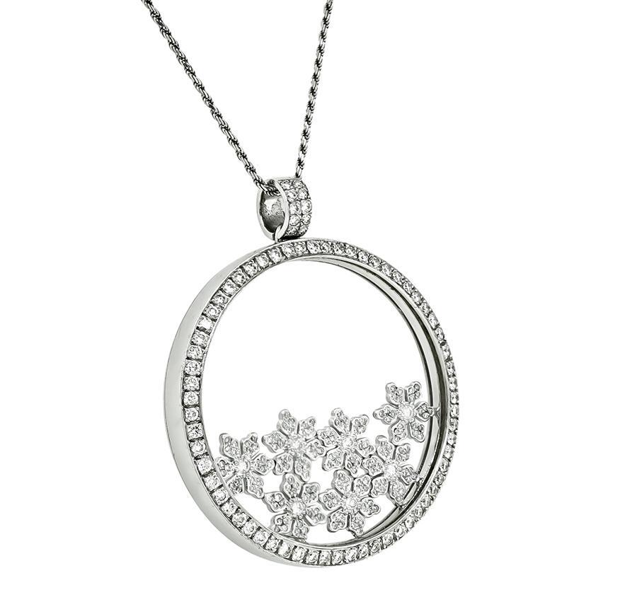 This is an amazing 18k white gold pendant necklace. The pendant is set with sparkling round cut diamonds that weigh approximately 3.50ct. The color of these diamonds is F-G with VS clarity. The pendant measures 50mm by 43mm. The 14k white gold chain