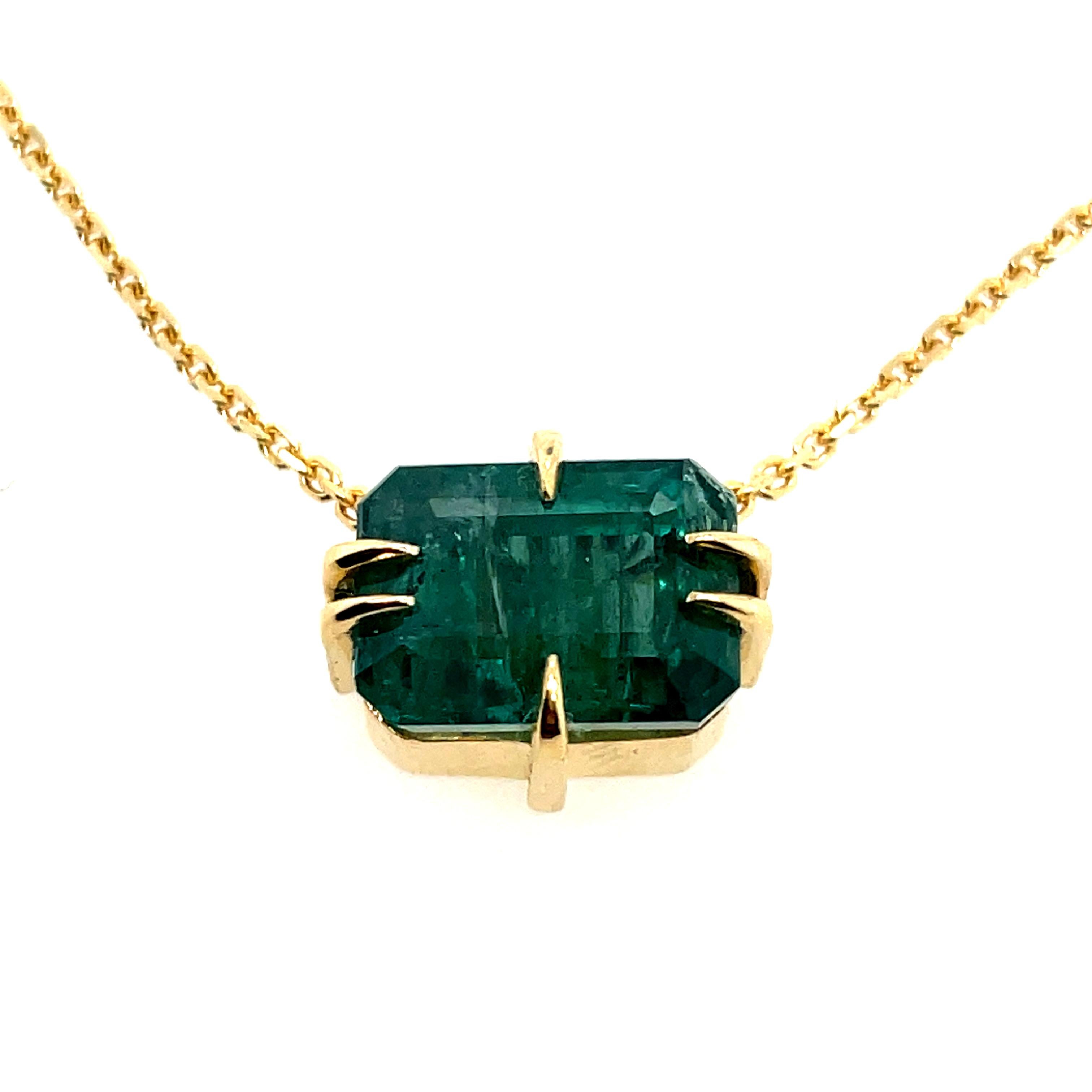 
3.50ct Lustrous forest green Emerald cut Emerald set in fierce claws in 18ct yellow gold with 40cm 18ct yellow gold chain.

Zambian emerald
Emerald cut
18k gold
40cm 18k chain
Ohliguer signature claws
Ready to ship in gift box
Comes with