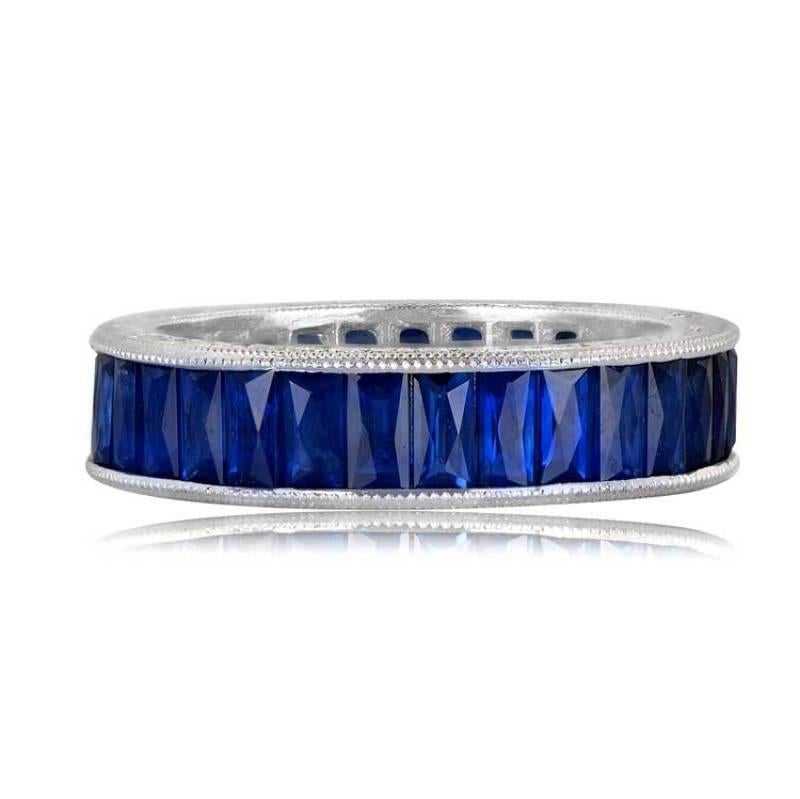 A meticulously hand-crafted eternity band showcases natural French cut sapphires, adorned with intricate milgrain detailing and engravings on a platinum band.

Sapphire Weight: The total approximate weight of the sapphires is 3.5 carats, tailored