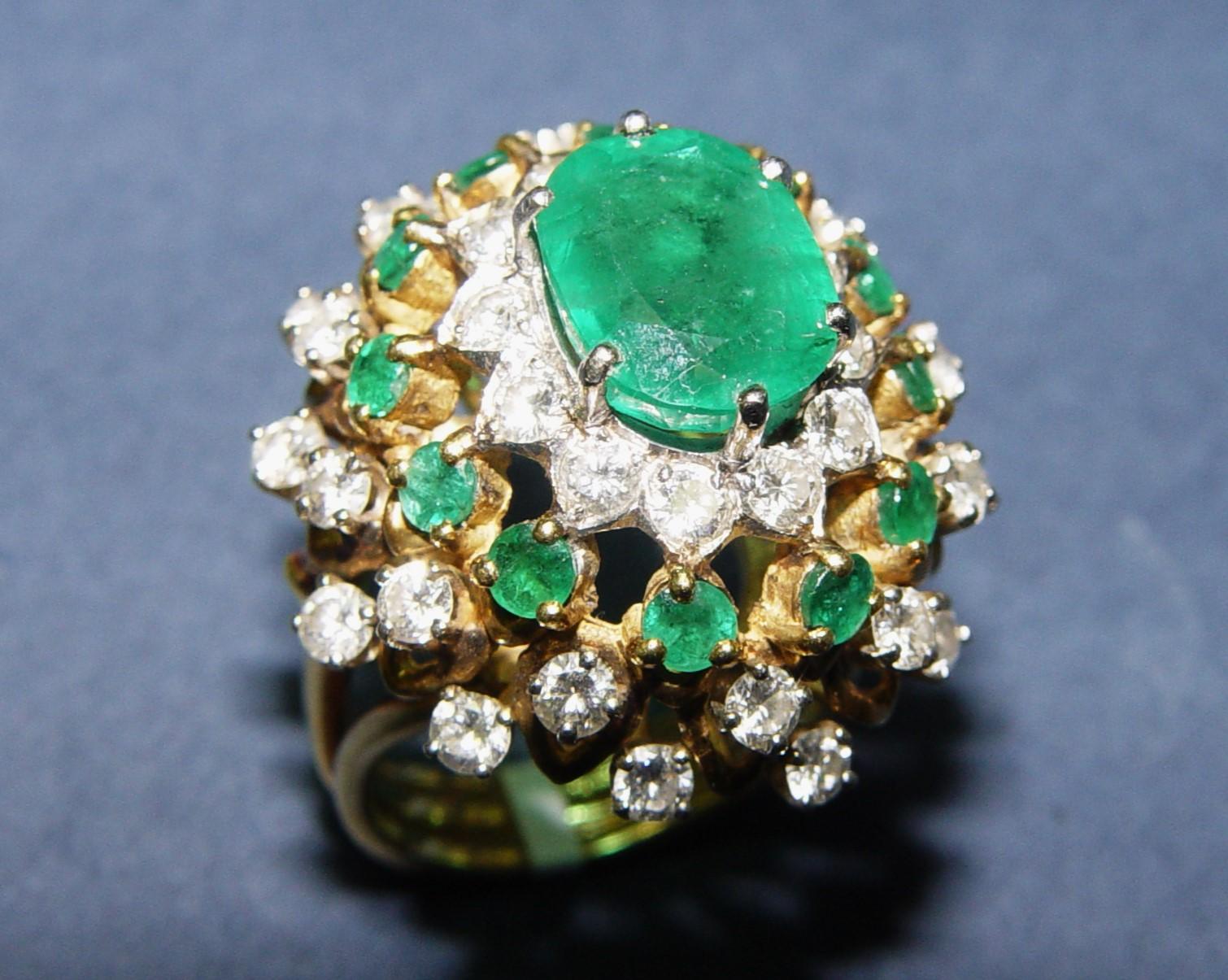 Vintage cocktail ring most likely from 1950's. Ring prong set with One Oval Cut natural Emerald weighing approximately 3.50CT (carat weight is accurate. Center stone measures 11.1x8.45x5.21MM deep, emerald exhibits saturated green green color and