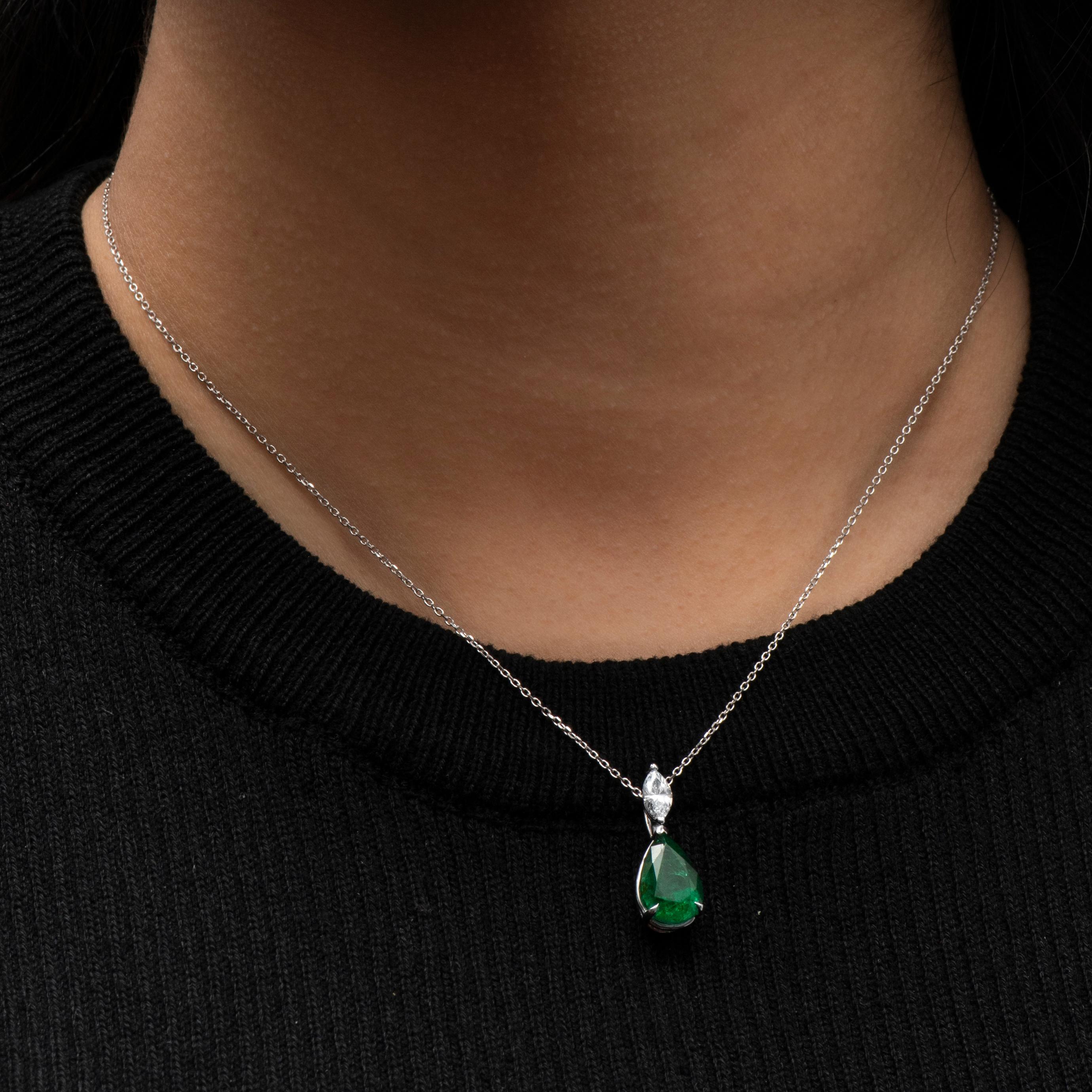 3.50ct Pear shape natural emerald with a 0.45ct Marquise shaped diamond set in an 18K white gold pendant. 

Diamond quality: D-E color, VS1-VS2 clarity 