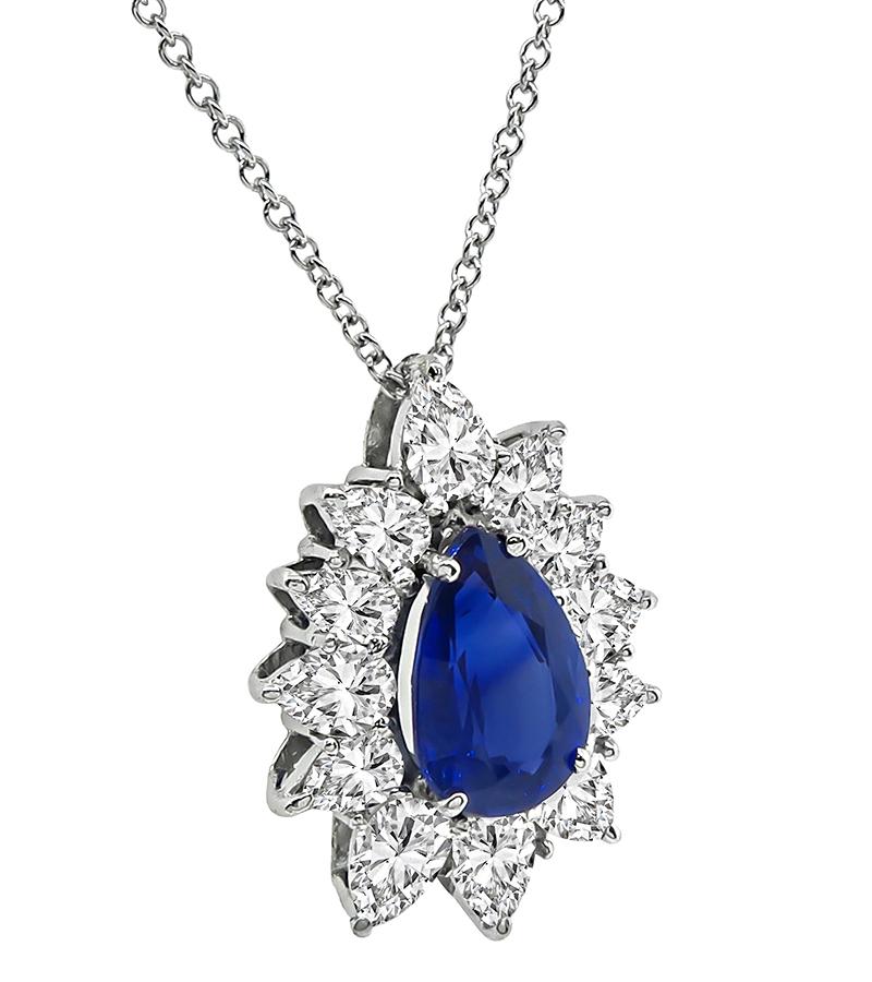 This is an elegant 14k white gold pendant necklace. The pendant is set with lovely pear shape sapphire that weighs approximately 3.50ct. The sapphire is accentuated by sparkling pear shape diamonds that weigh approximately 3.00ct. The color of these
