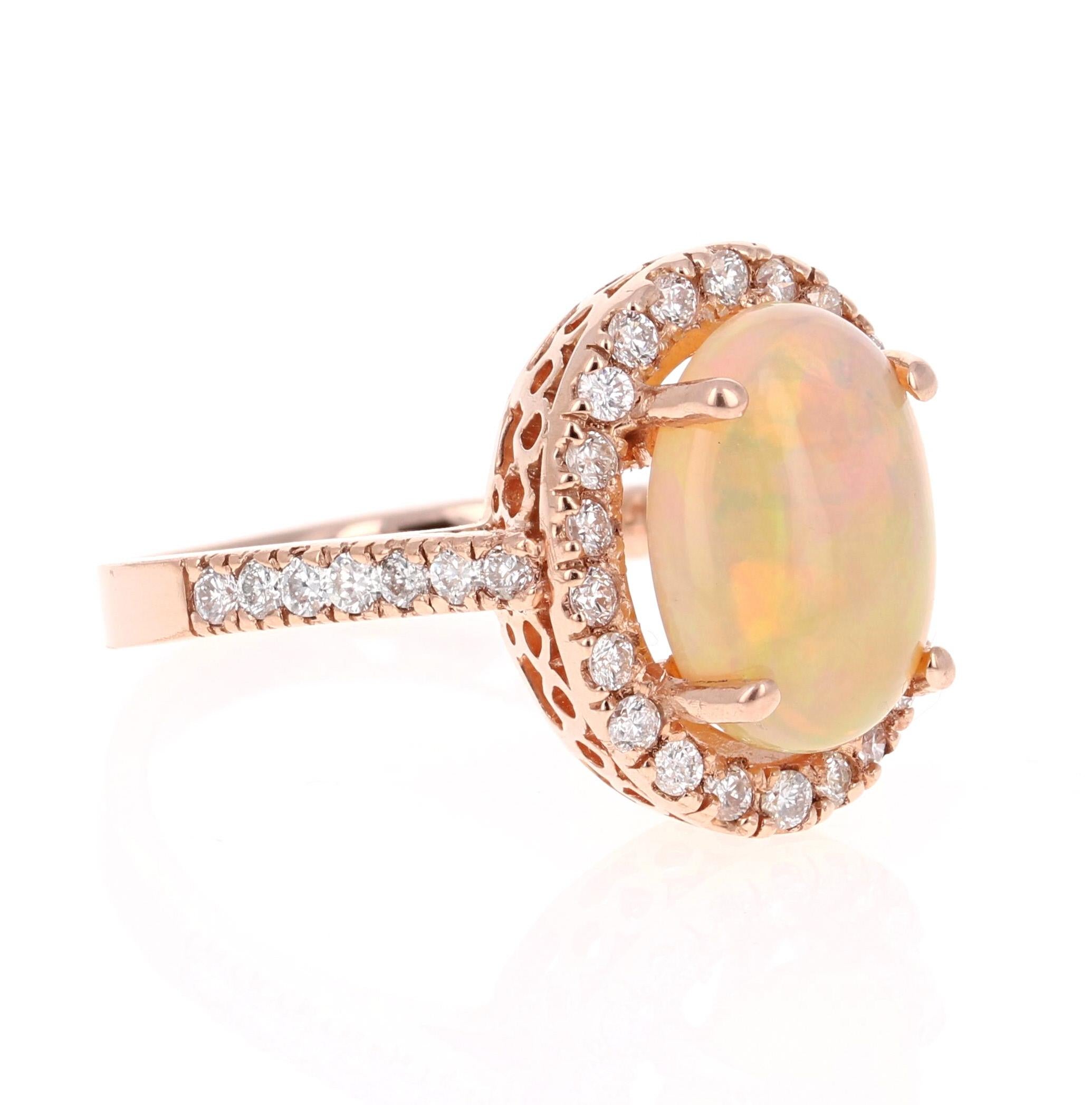 This ring has a 2.81 Carat Opal that is curated in a unique 14 Karat Rose Gold setting. The setting is adorned with 32 Round Cut Diamonds that weigh 0.70 Carats. The total carat weight of the ring is 3.51 Carats.

The Opal displays beautiful flashes