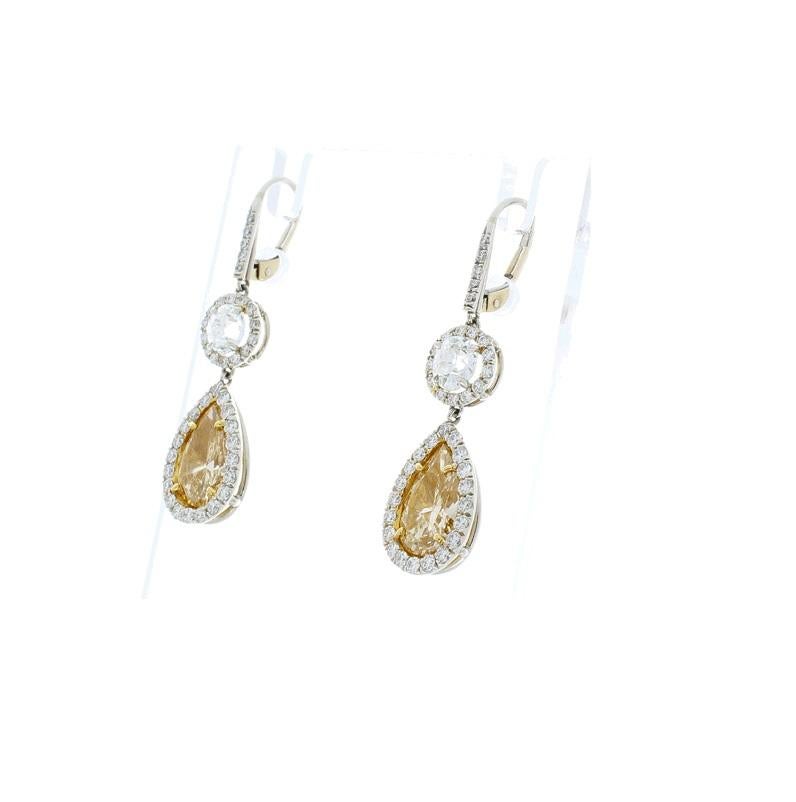 Contemporary 3.15 Carat Pear Shape Fancy Yellow Diamond Dangle Earrings in Platinum