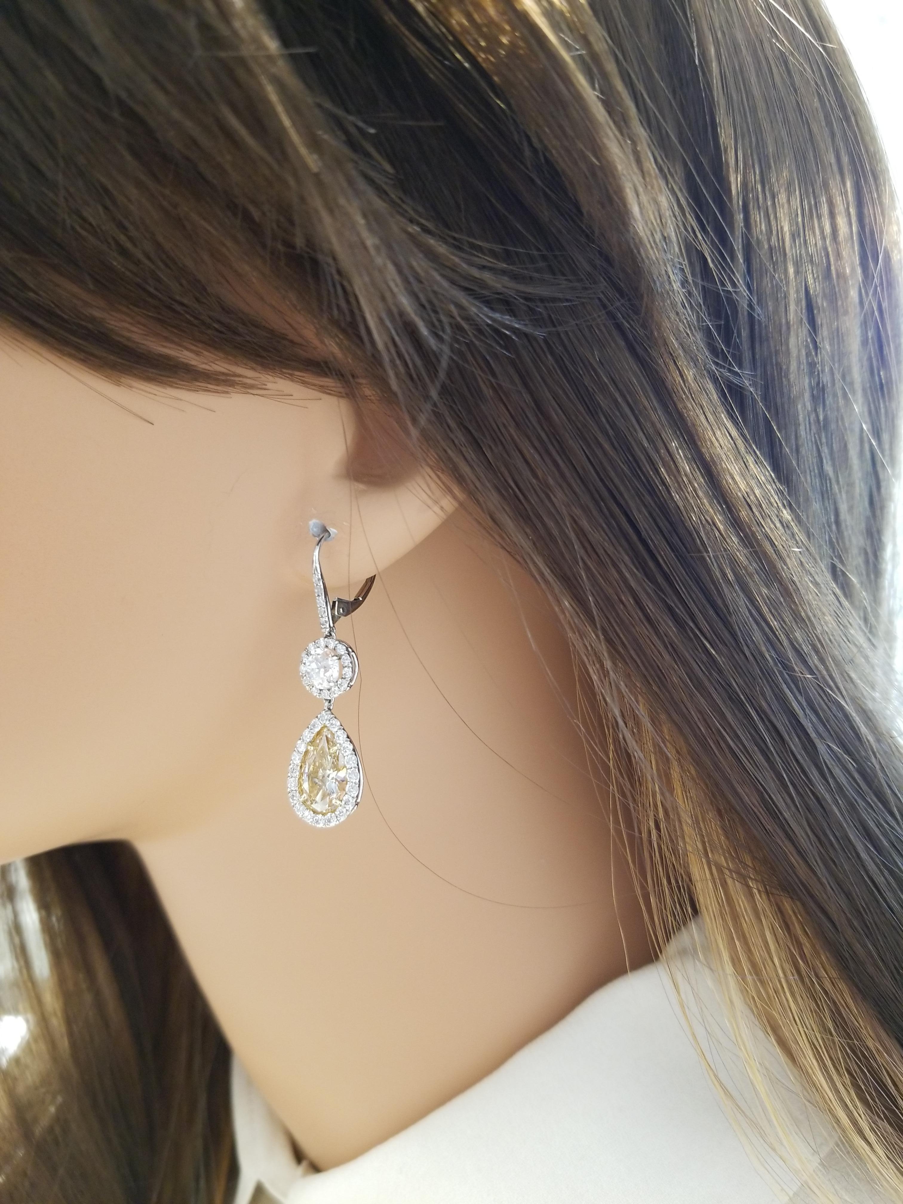 Women's or Men's 3.15 Carat Pear Shape Fancy Yellow Diamond Dangle Earrings in Platinum