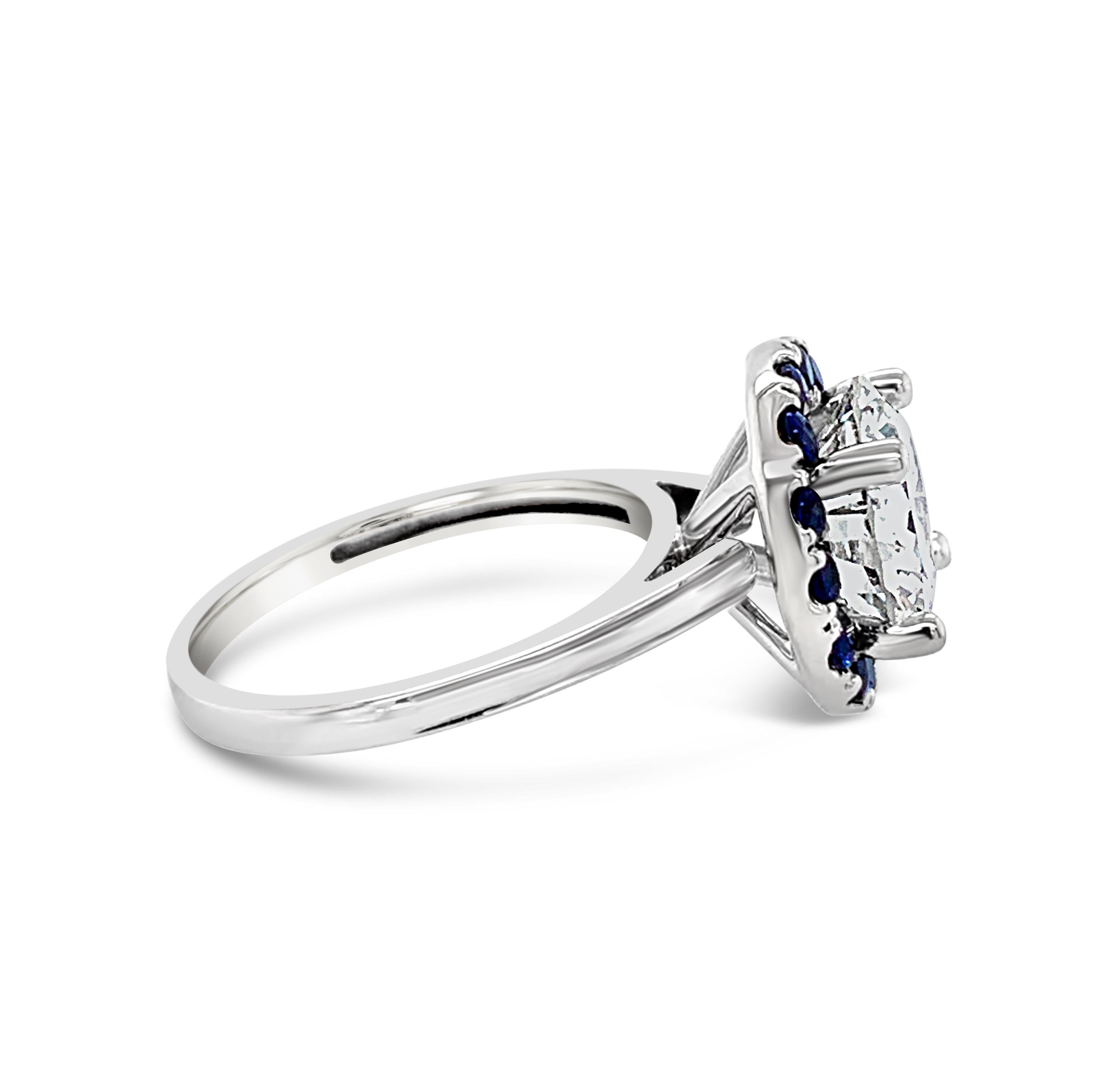 3.51 Carat Round Brilliant Diamond Sapphire Halo Ring in 14K White Gold.  Center round brilliant cut diamond color grade is H and clarity is VS-1.  Sapphire halo is 1.85 Carat (total weight).  
