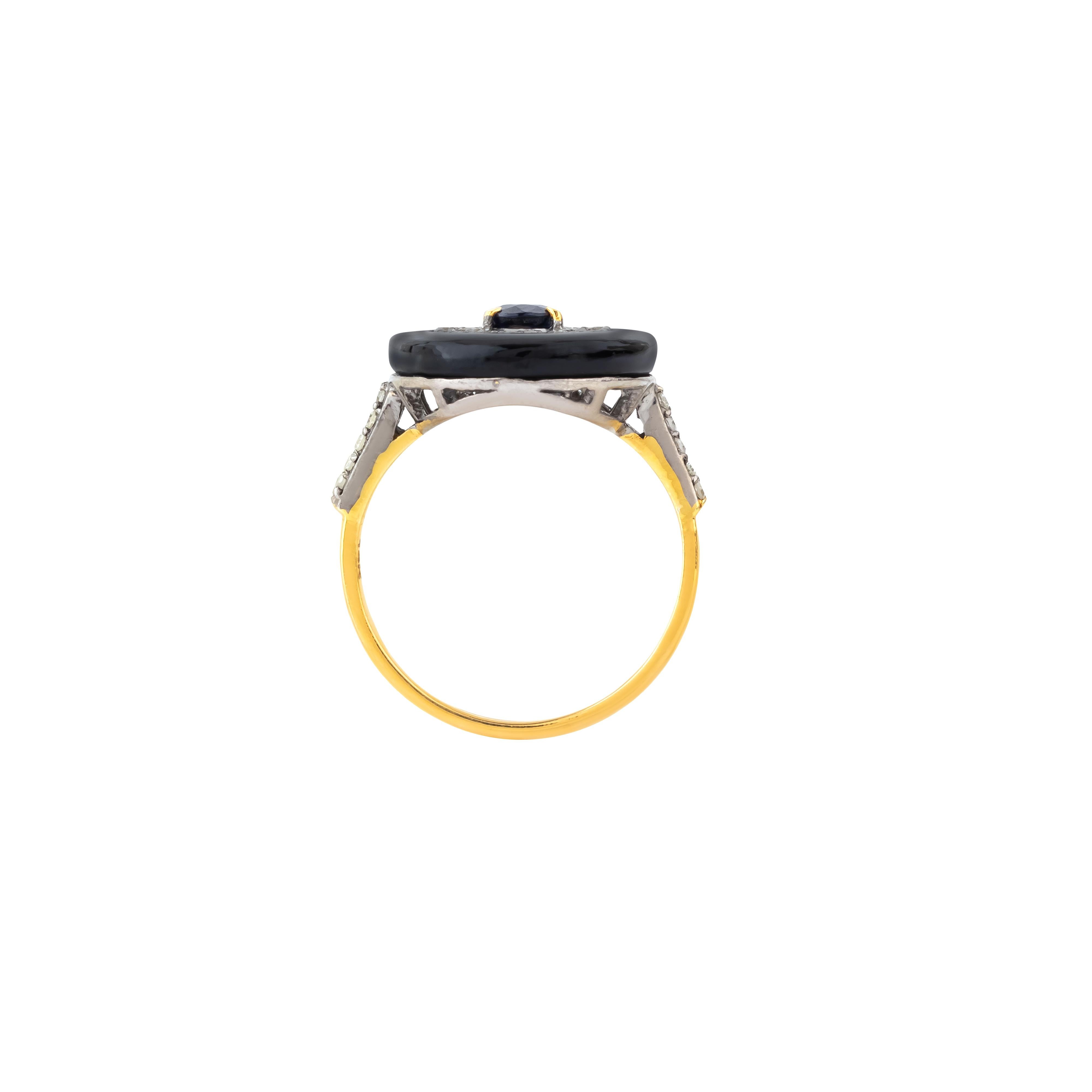 The 3.52 Carat Diamond, Black Onyx, and Sapphire Cocktail Ring exemplifies a striking balance of elegance and bold design. This captivating piece features a central sapphire, renowned for its deep blue hue and exceptional clarity, surrounded by a