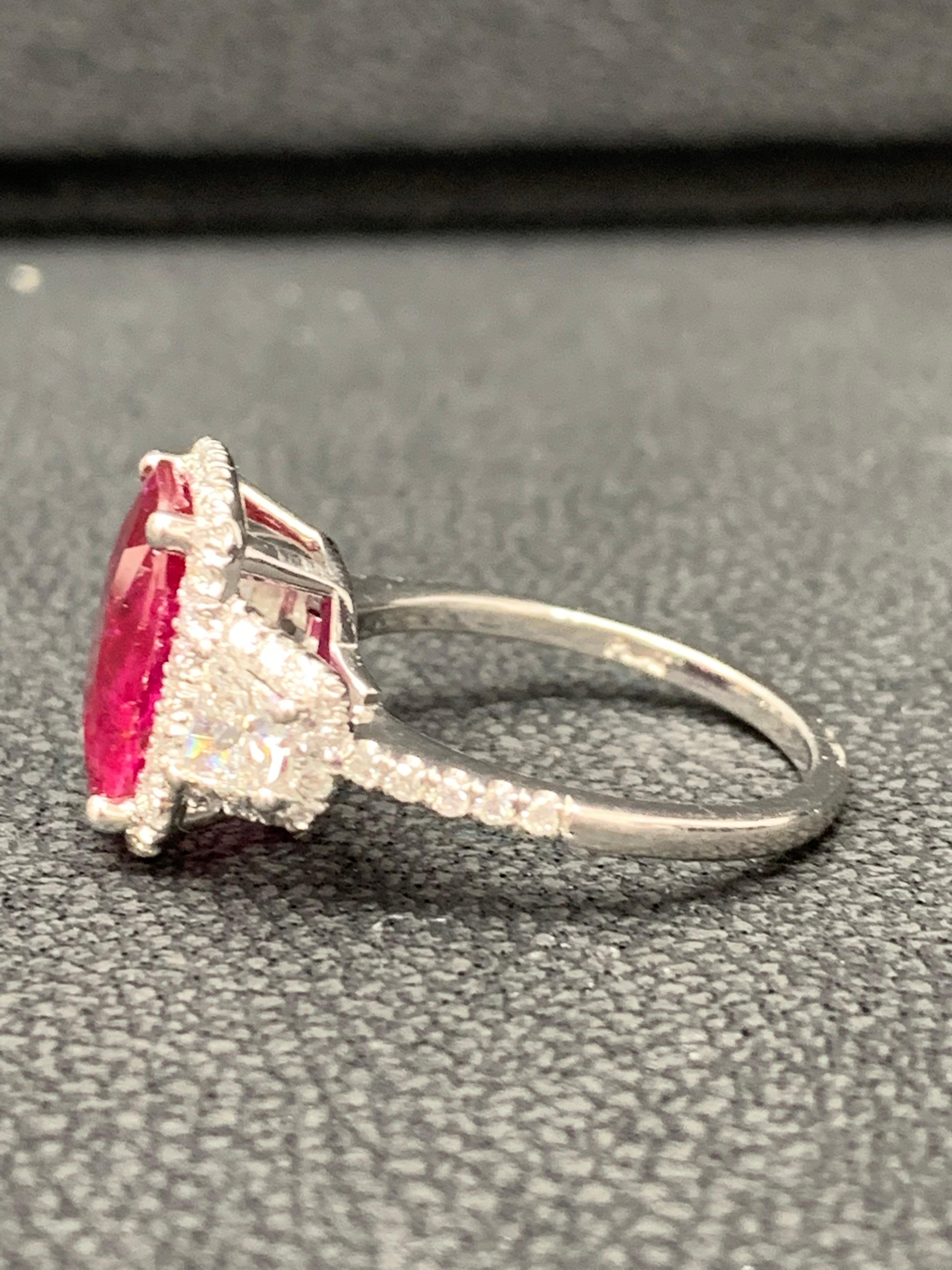 Modern 3.52 Carat Elongated Cushion Cut Ruby and Diamond Three Stone Ring in Platinum For Sale